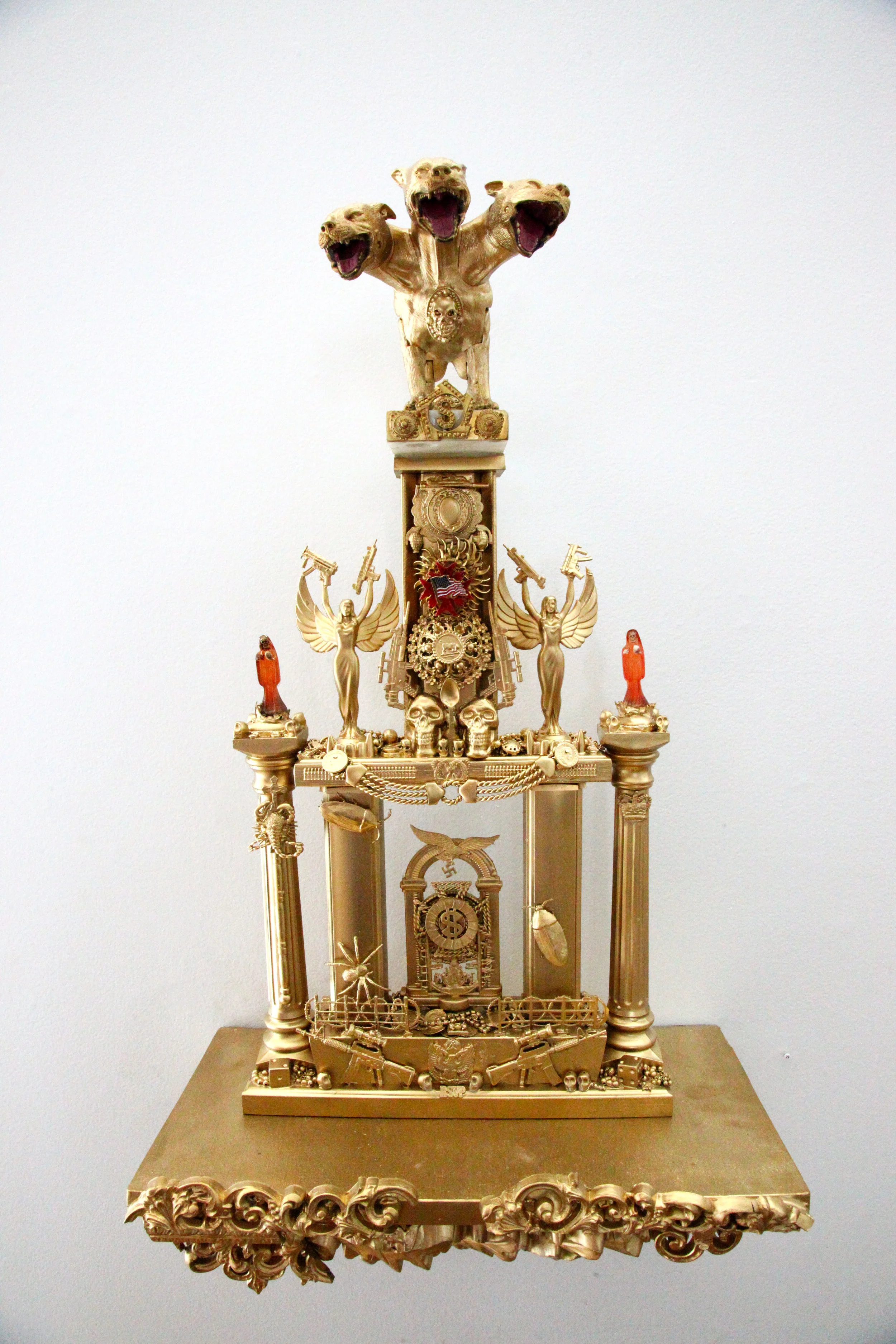 "Trophy #6 -- Cerebus, The Guardian of the Gates of Hell" Mixed media, found objects 26" x 12 1/2" w/o shelf, 33" x 17 1/2" w/shelf 2016