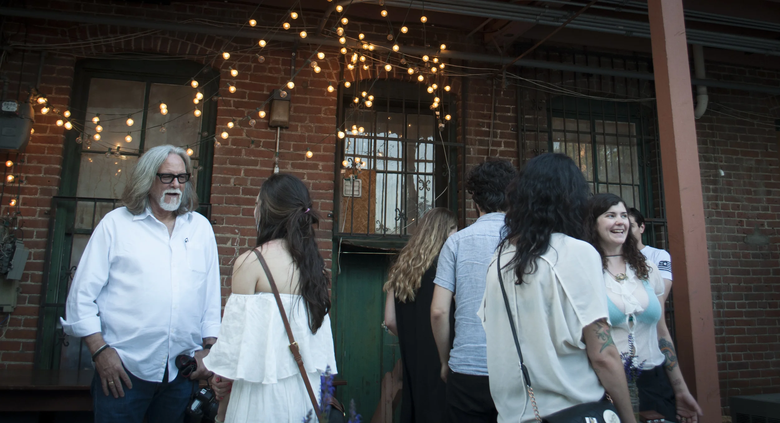 At the Opening Reception of "Observing (A)trophy Life - Celebrating Our Luxury of Social, Personal and Political Addiction" at Leon Gallery, Denver, Colorado, 2016. Photo courtesy by Odessa Denver 