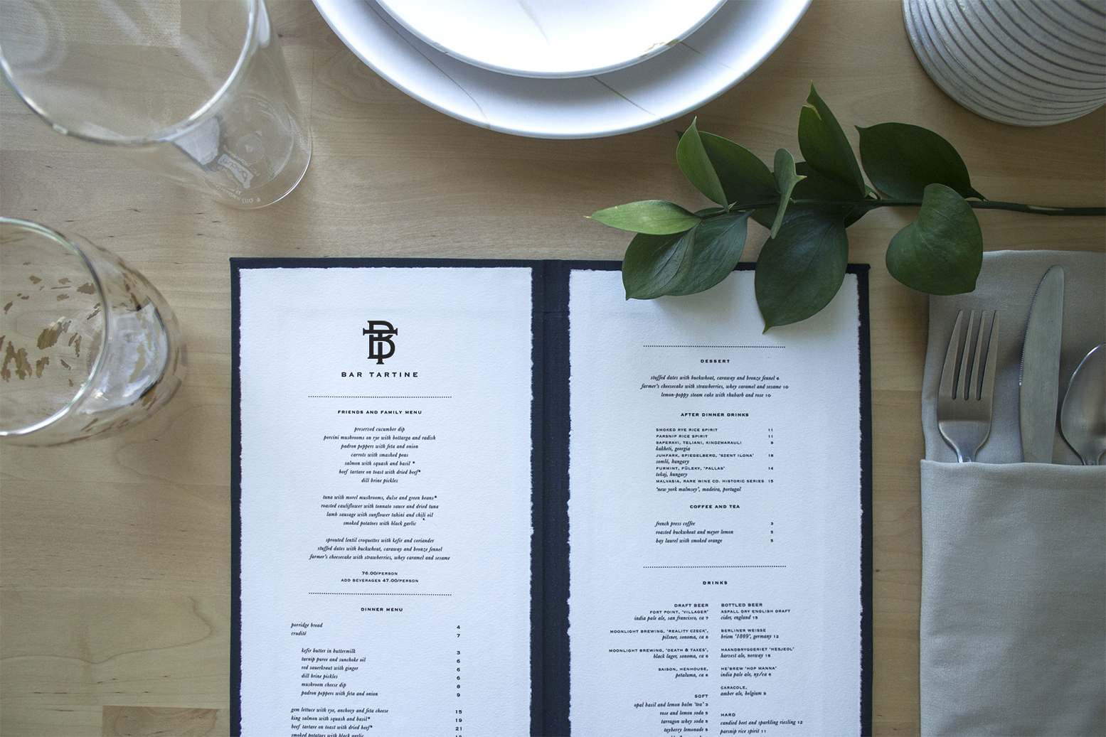 Bar Tartine, known for its cuisine focused on local produce and comforting atmosphere, needed a menu design that would capture the warm aesthetic of the restaurant. The logo and typeface used in the menu convey a mature but contemporary design. The menu was wrapped in a linen cloth, which combines the elements of natural textures with modern aesthetic of the menu design. 
