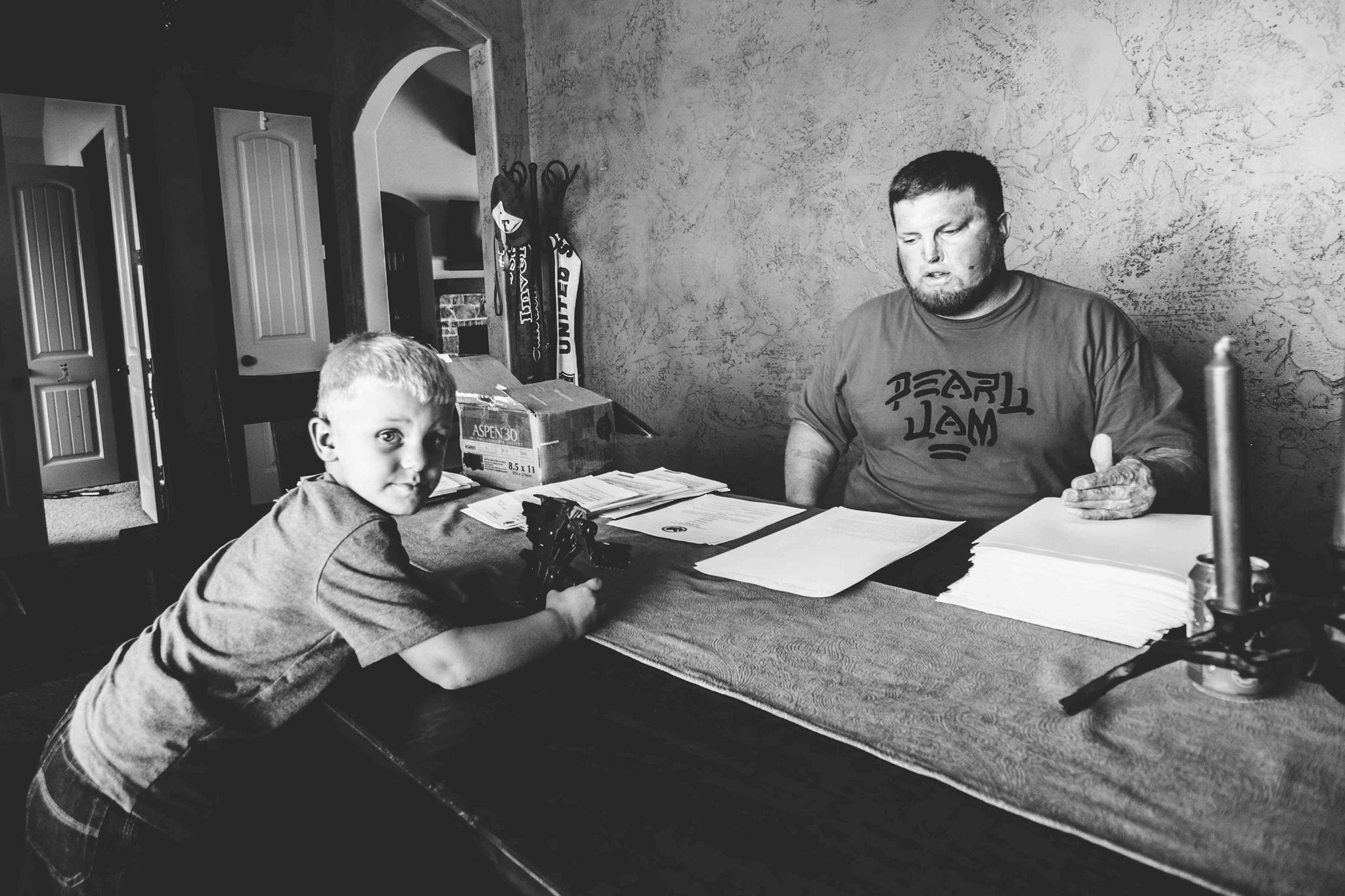 Joe with son King and a mountain of VA paperwork. 