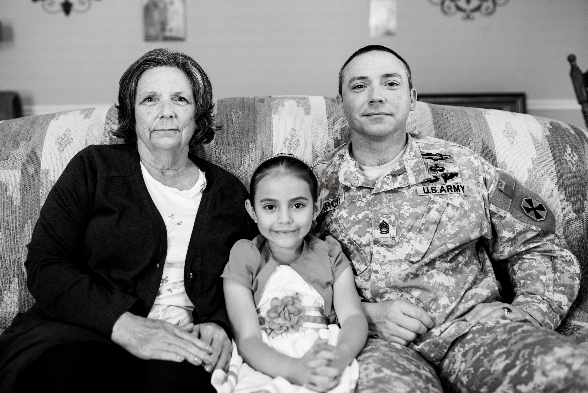SFC Garcia seated with his mom Brenda (retired Air Force) and daughter Kaylee.