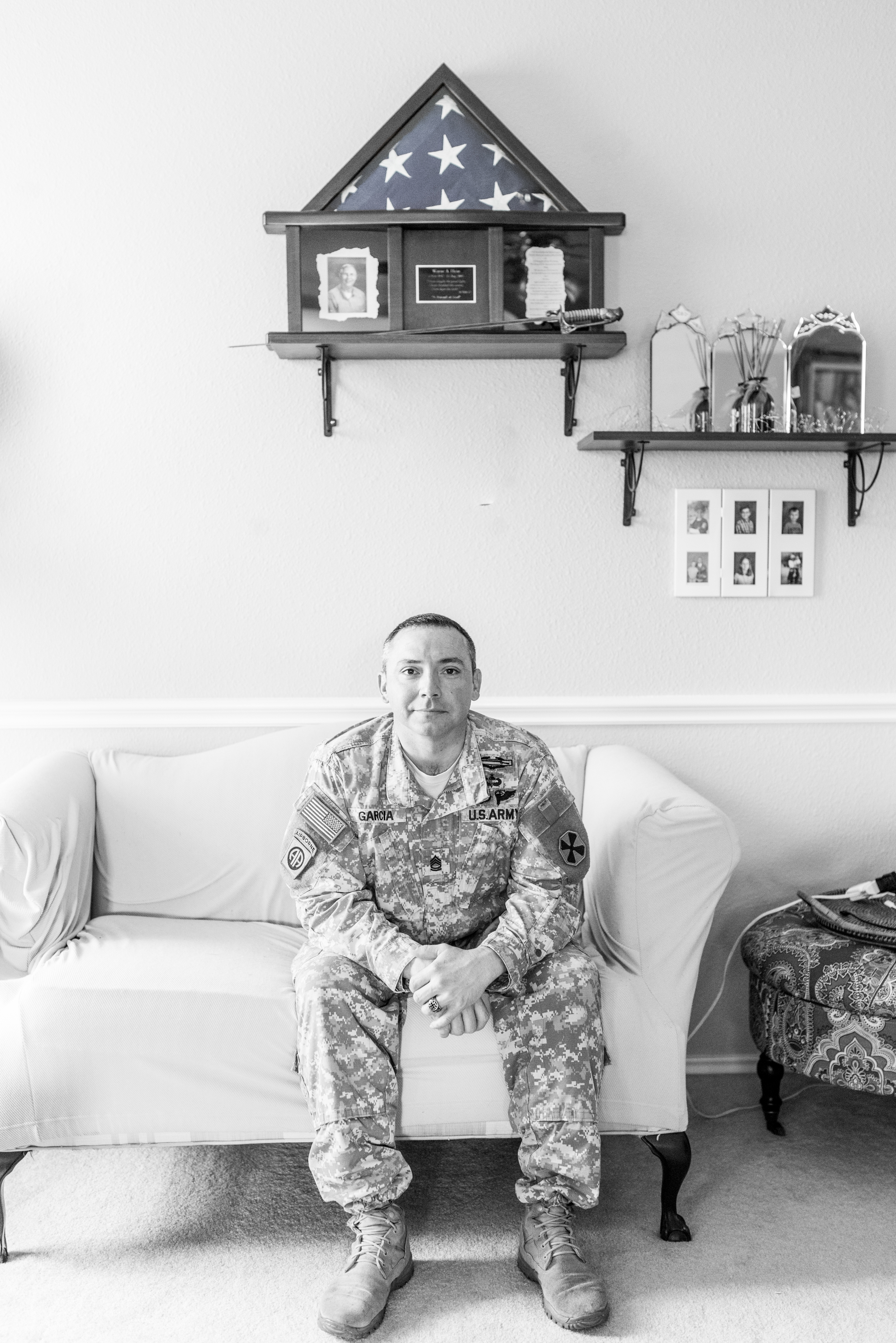 Jeremy sits below the shadow box honoring his late step-father, Wayne, a retired Air Force Captain and Pastor.
