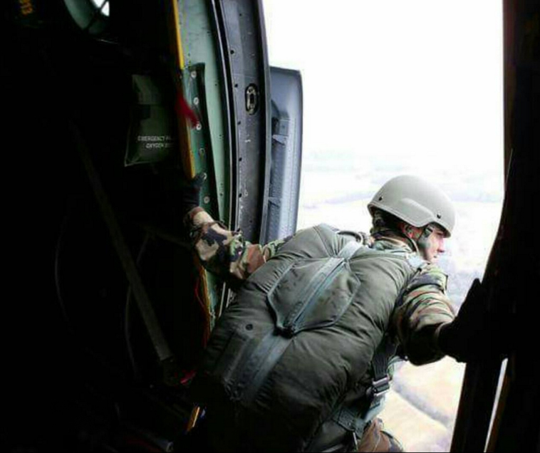 Garcia performing "jumpmaster duties," on a C-130.