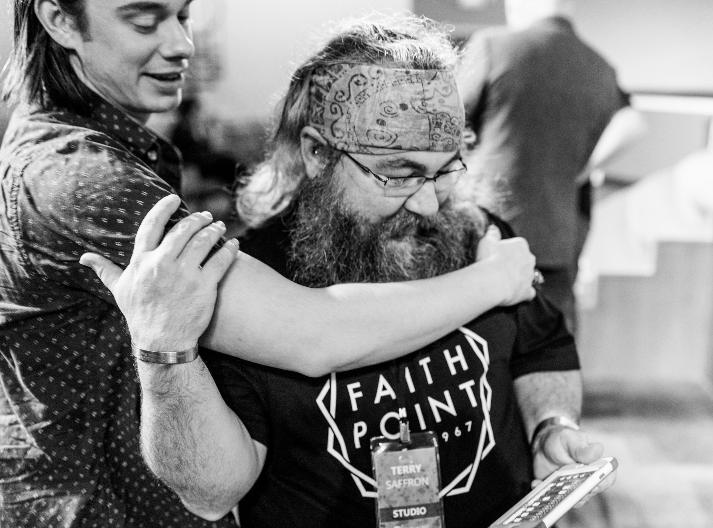 Terry receives a hug from one of his good friends and Worship Leader at Faith Point, Tyler Hoxworth. 