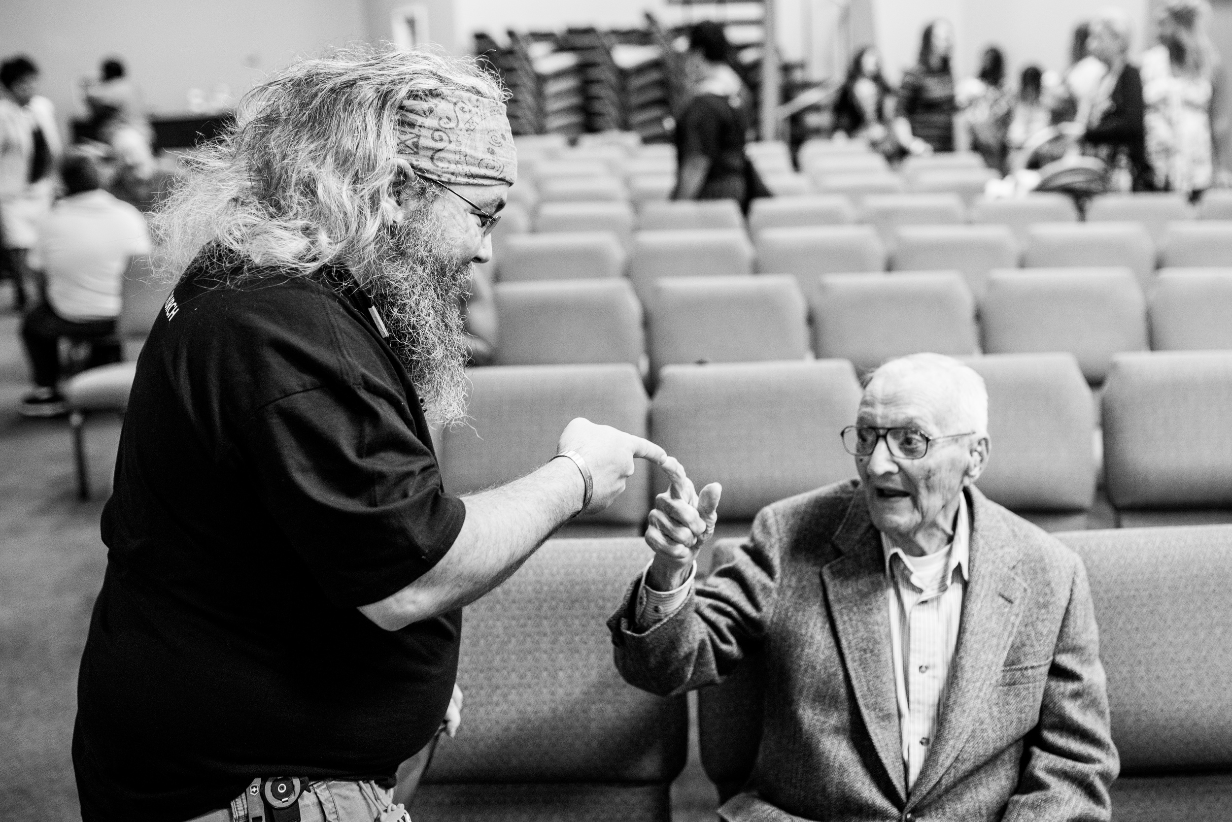 Terry shares his "secret handshake" with one of Faith Point's regular attendees. 