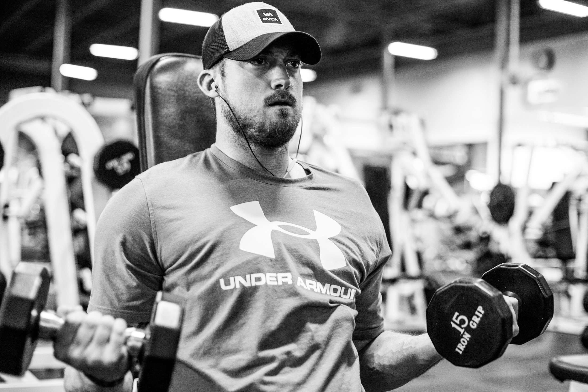 Evan works through a high intensity set of high rep, light weight curls. You can see the brace he wears to support his shoulder. 