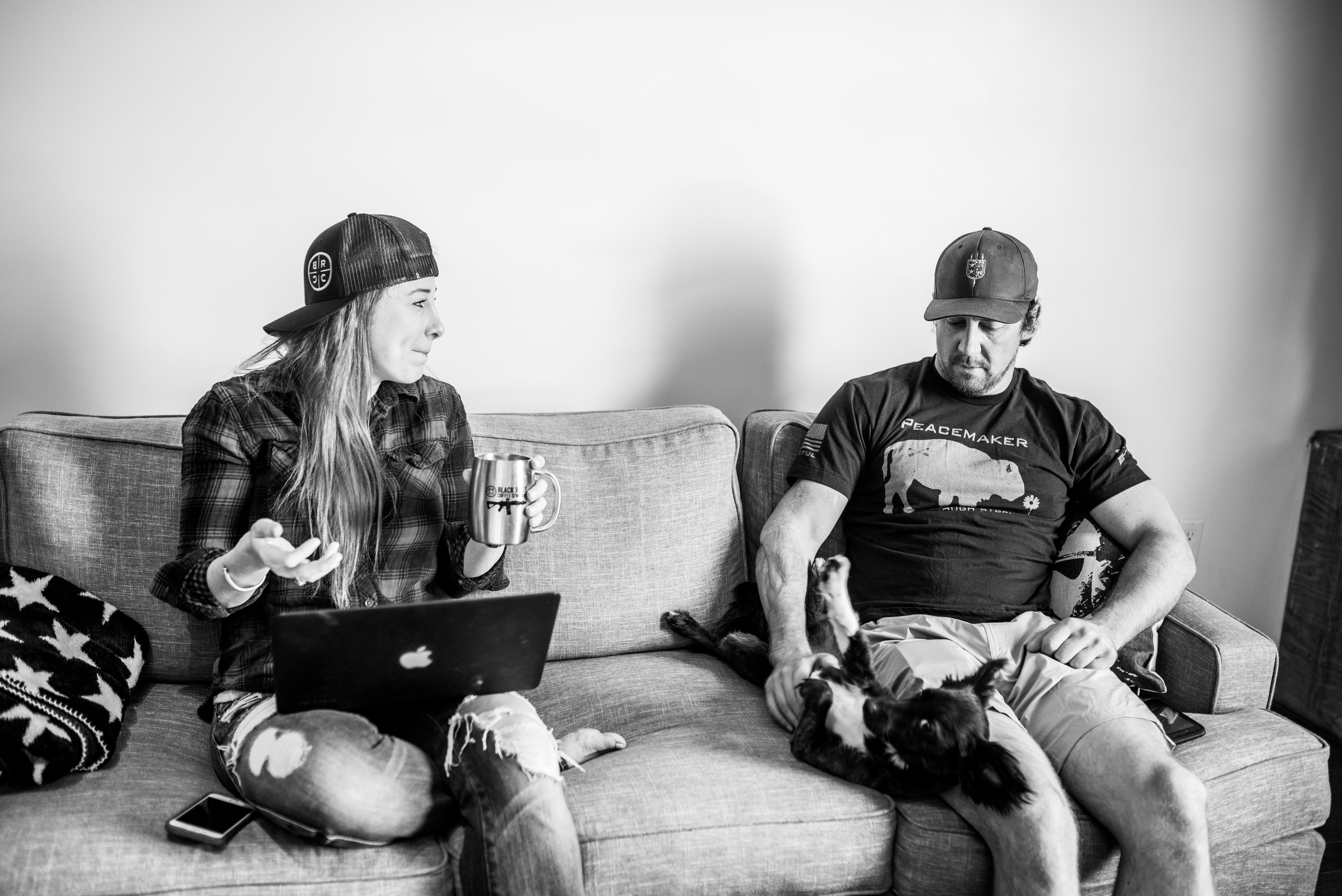 Tyler sits with his girlfriend Jaclyn Renee (Owner of Red's Pantry) and dog, Master Splinter. 
