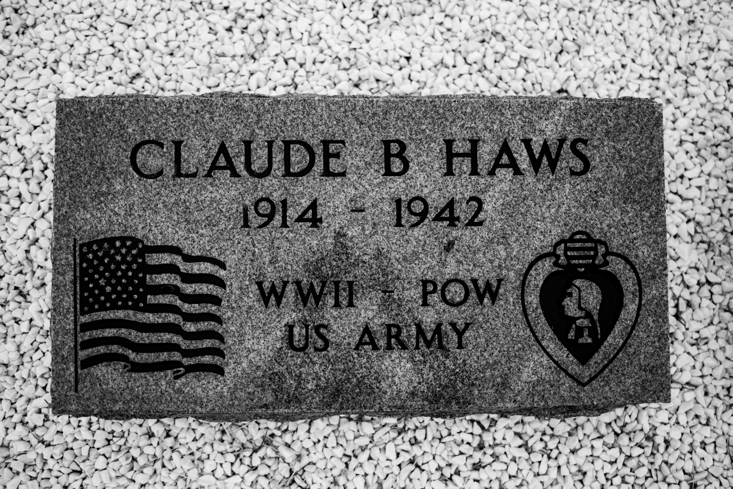 Claude Haws' memorial sits in Logan, New Mexico. His niece and her husband designed the marker in homage to his WWII service and death at Camp O'Donnell. His body is still in the Philippines. 