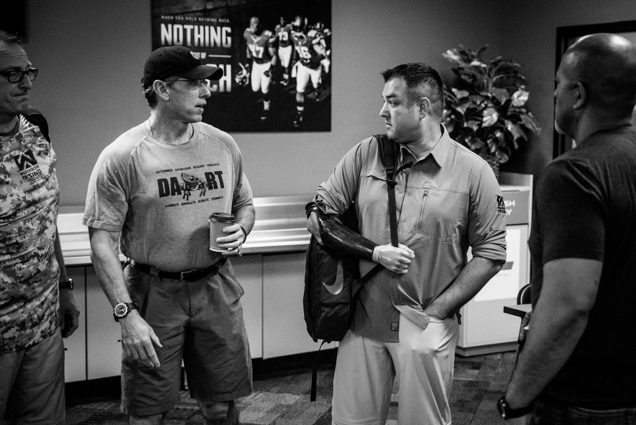 Petry speaks with Minnesota Viking's GM Rick Spielman before leading players and VIPs on a mentorship weekend.