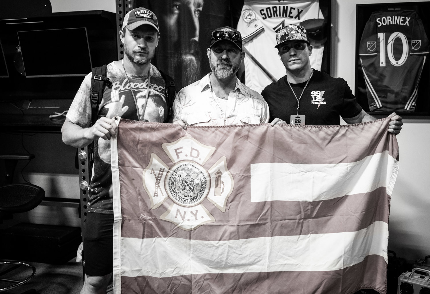 Brady stands with the FDNY Ladder 10 Flag owned by his friend, Duncan Butler. Duncan is the Business Development Specialist for Zac Brown Band.