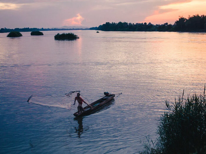 Fisherman throwing the last net of the day.