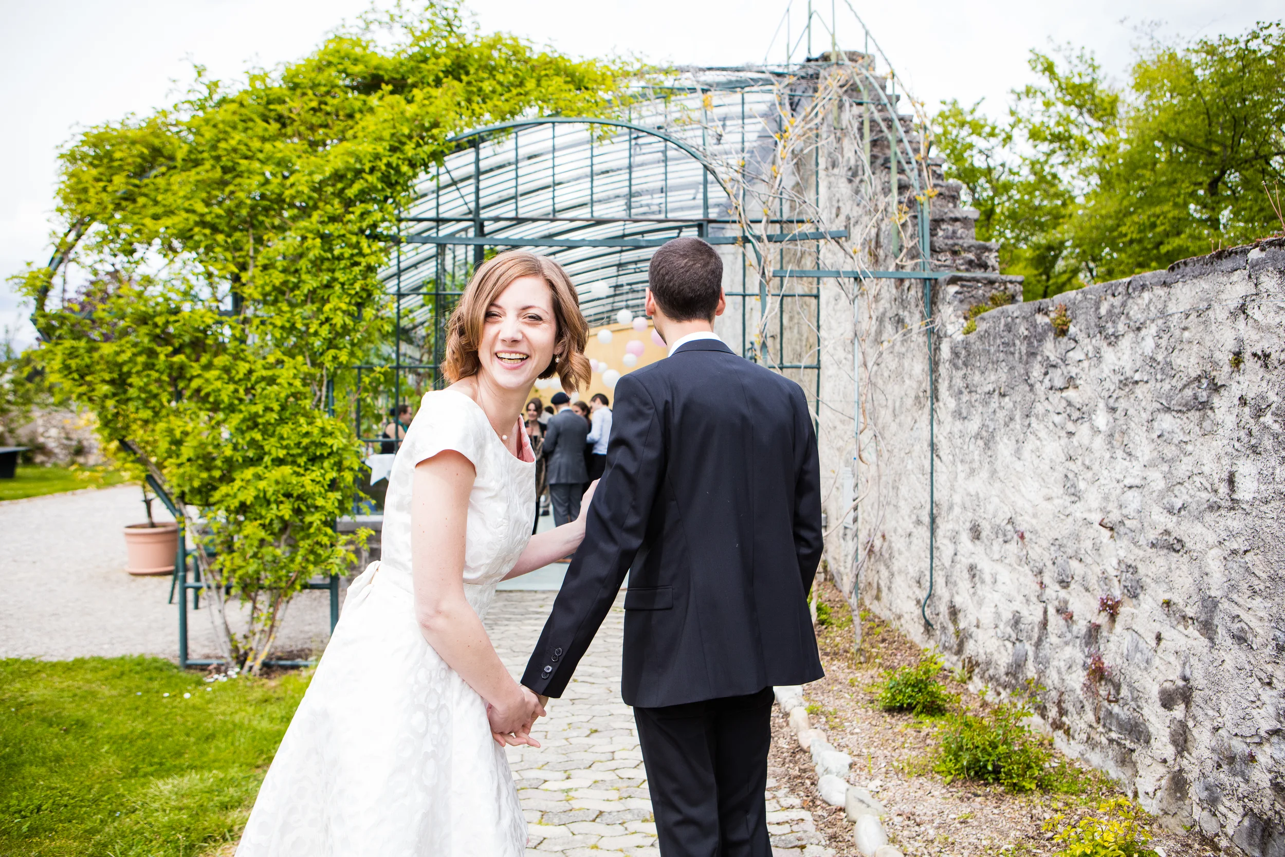 Simple white casual wedding dress with cap sleeves and contrast pink lining