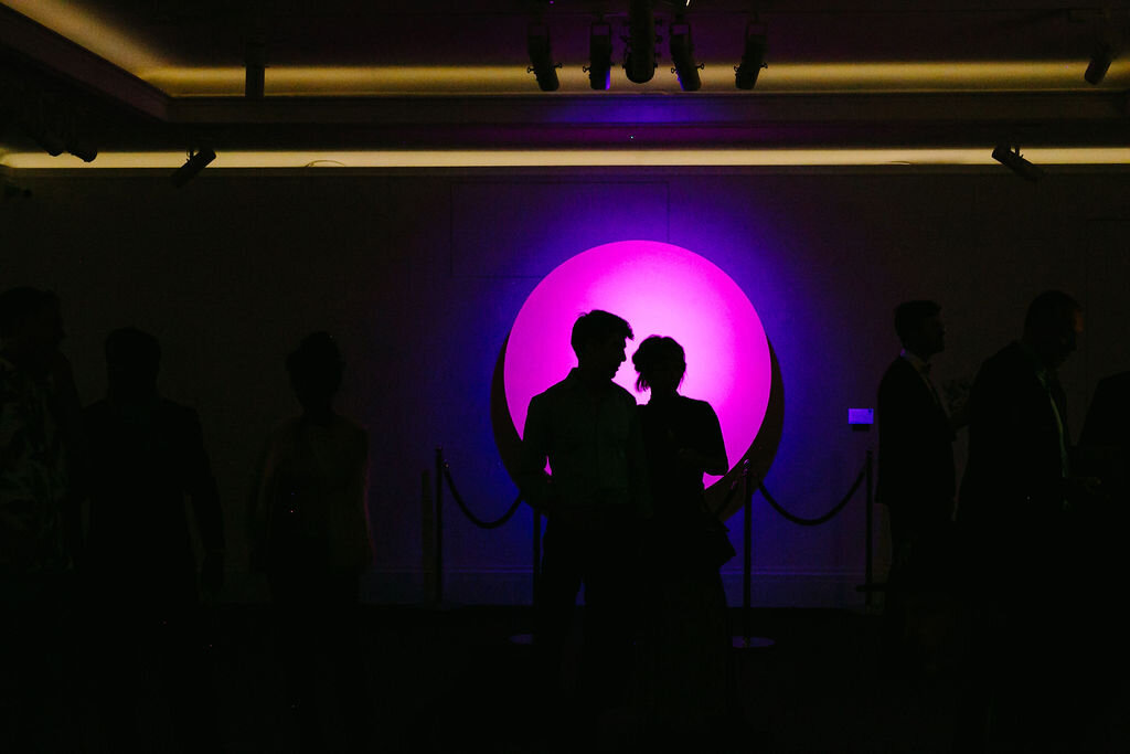 Chris Levine light installation with two people silhouetted 