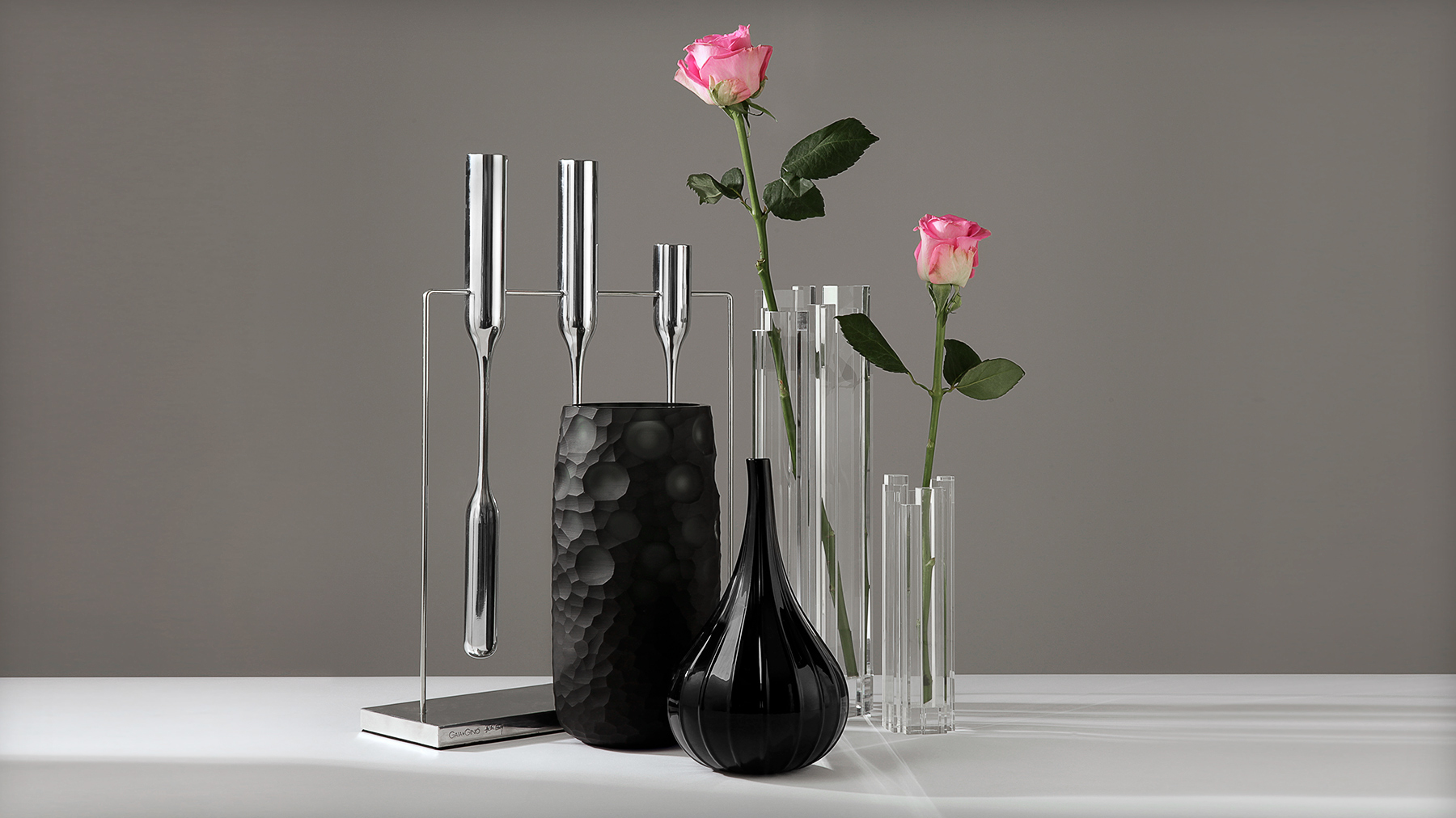 Studio photography example: still life on grey background, reflective products