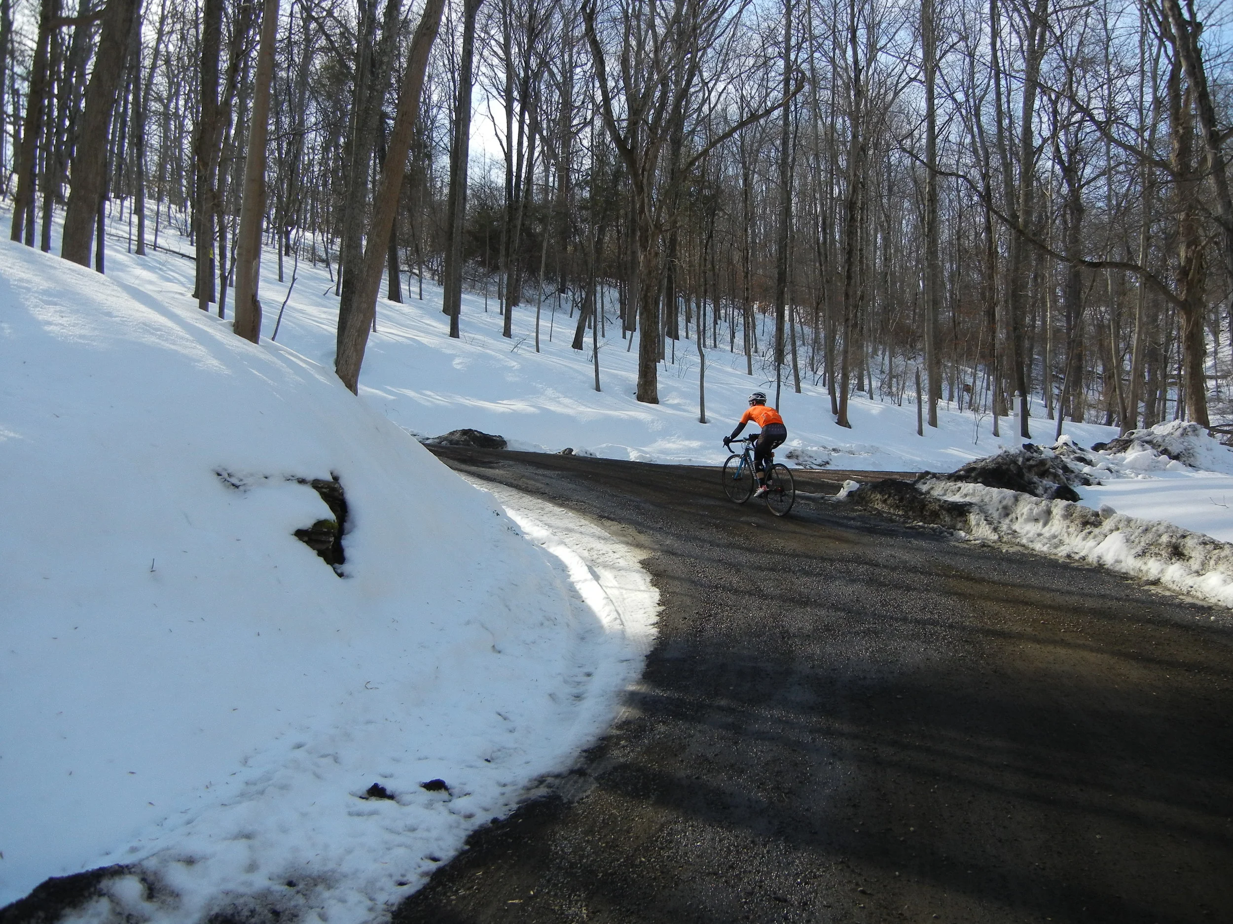 It's quite difficult to capture the steepness of this climb whilst riding. It's even more difficult to tackle a steep gravel climb with a car coming down just behind the snow bank.