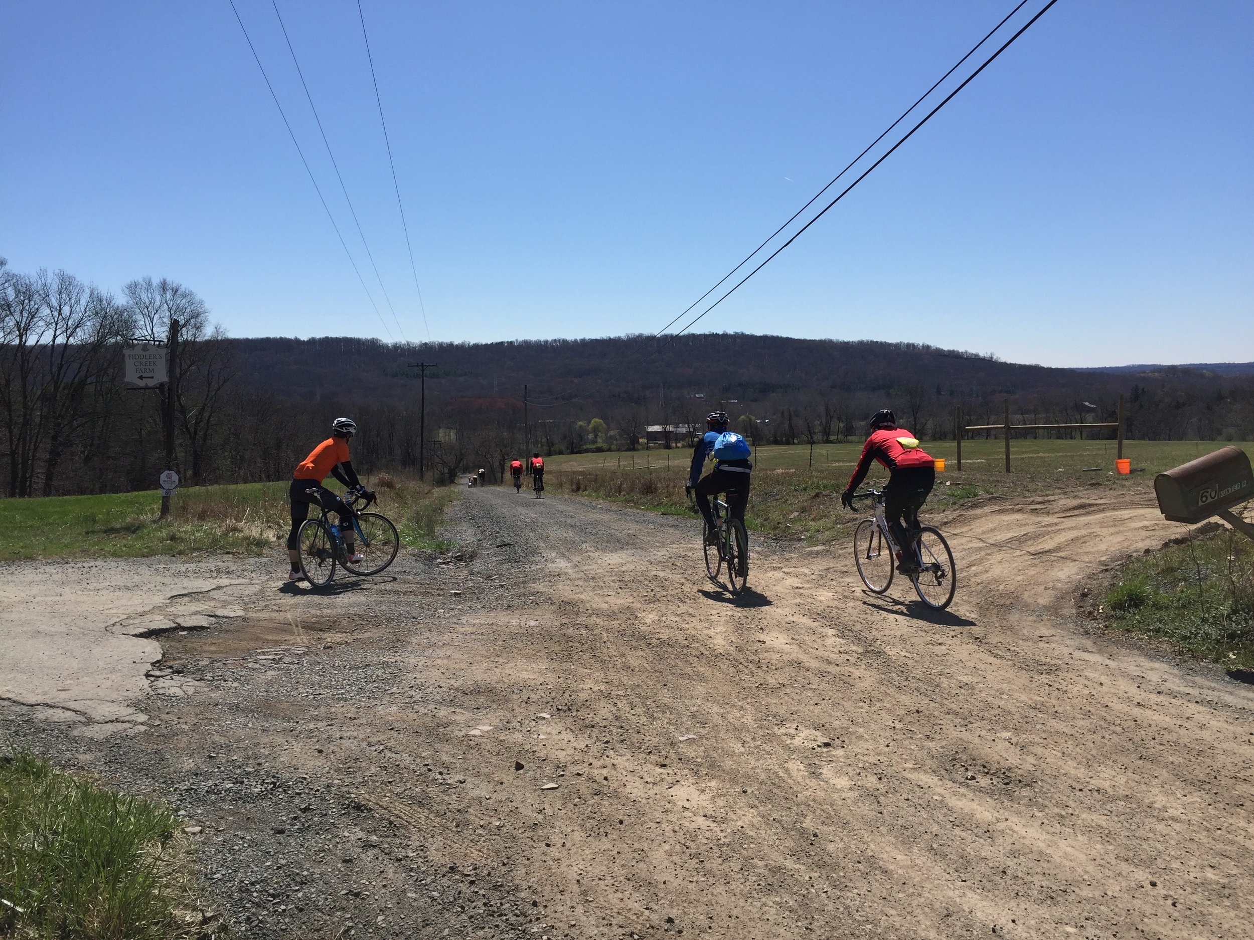 Pausing for a moment to take in the view on Wilson Road, one of the final unpaved segments.