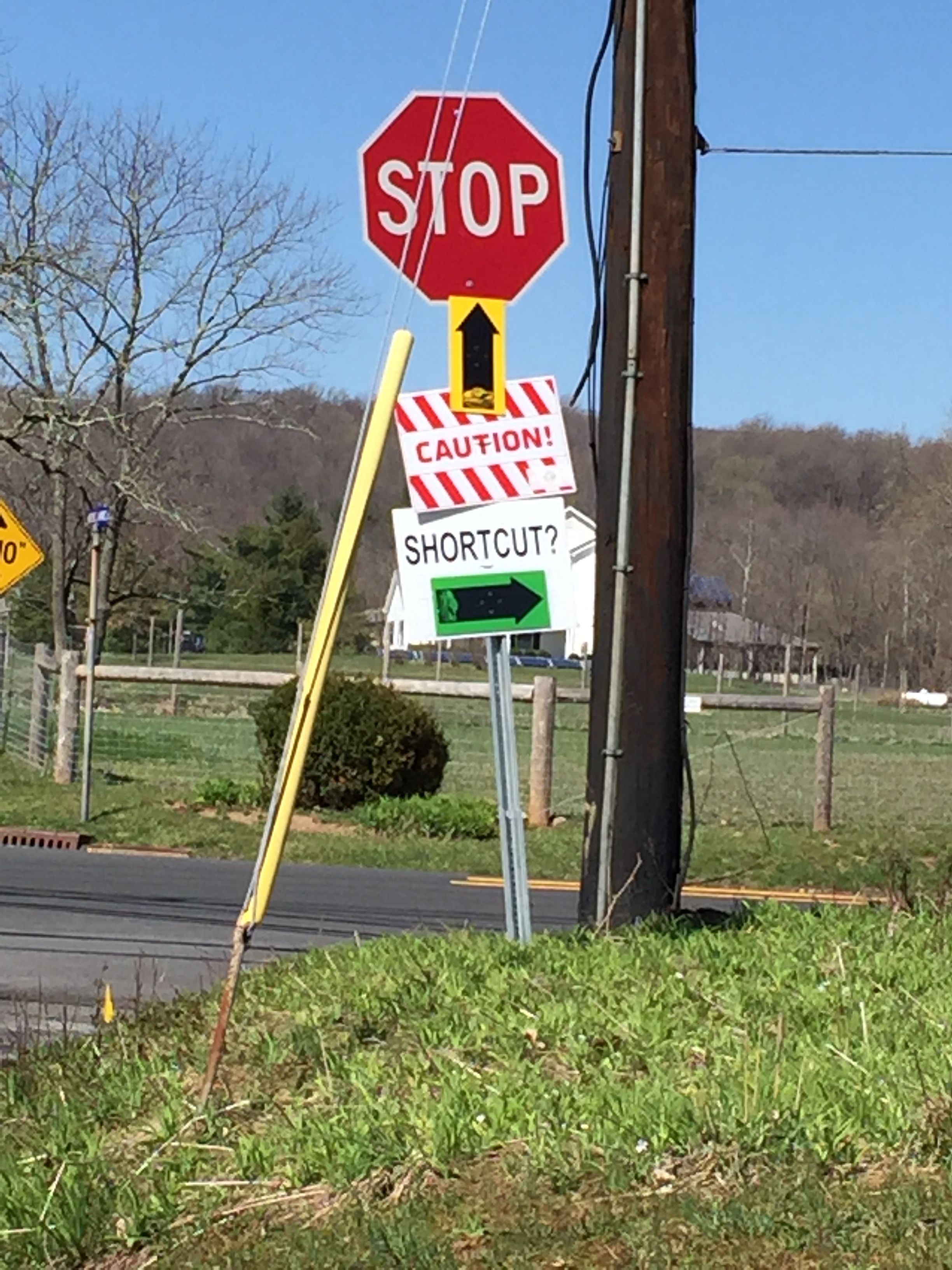 The tantilizing sign that indicates it could all end easily by using the shortcut instead of Hopewell Amwell Road's Climb. We still attacked the climb.