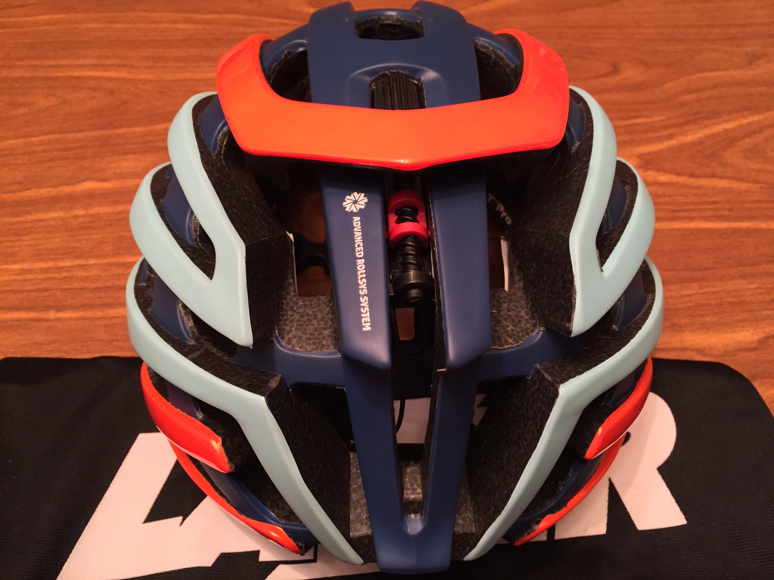 A closeup view of the Advanced Rollsys System. The black thumb wheel ahead of the orange cowling is the adjuster. The black screw is the tensioning system. According to Lazer, by moving the sizing options to the top of the helmet allows for a symmetrical fit as well as appealing to riders who have ponytails.