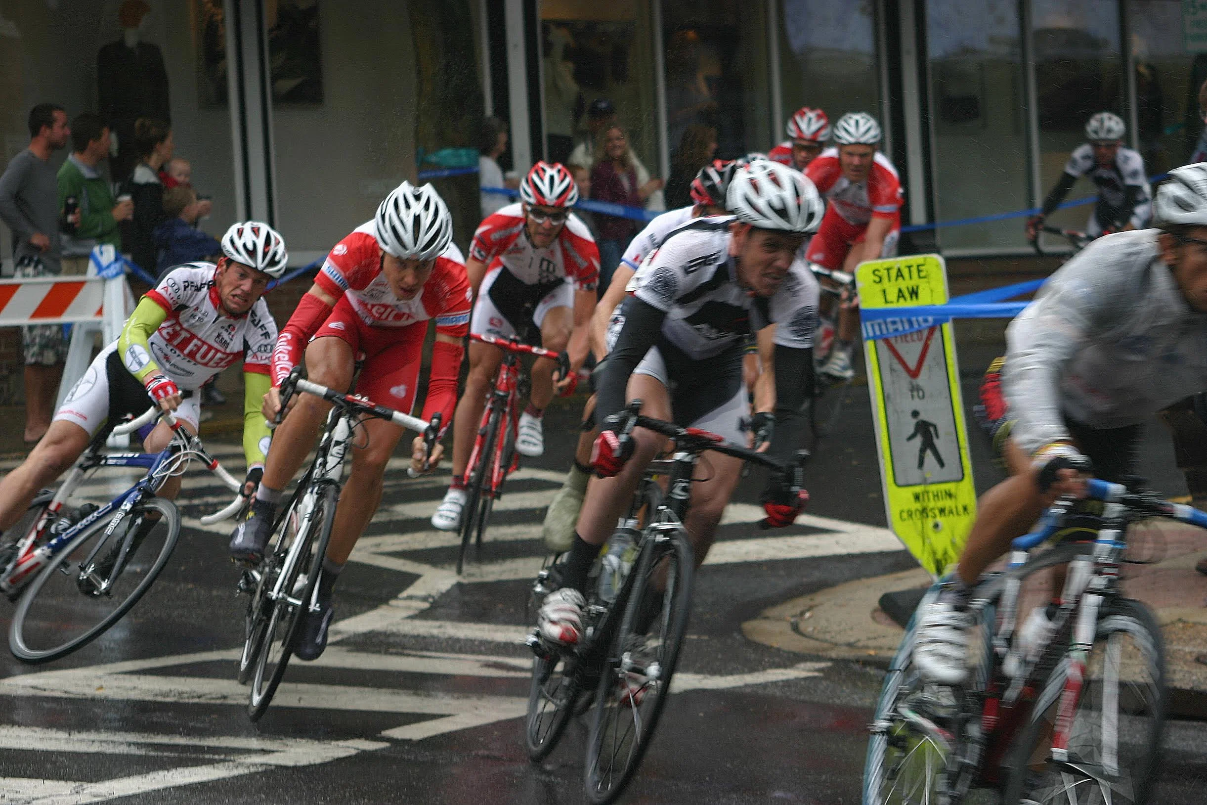 The 2010 Doylestown Criterium had the unfortunate combination of rain and painted roadways. Perhaps if they moved the pedestrain sign into the road things would have been safer. Photo courtesy Chuck Rudy.