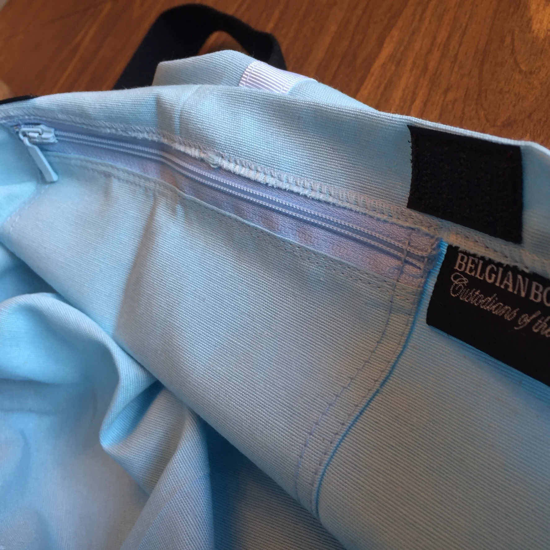 A close-up of the zippered compartment. This bag has two Velcro sections.