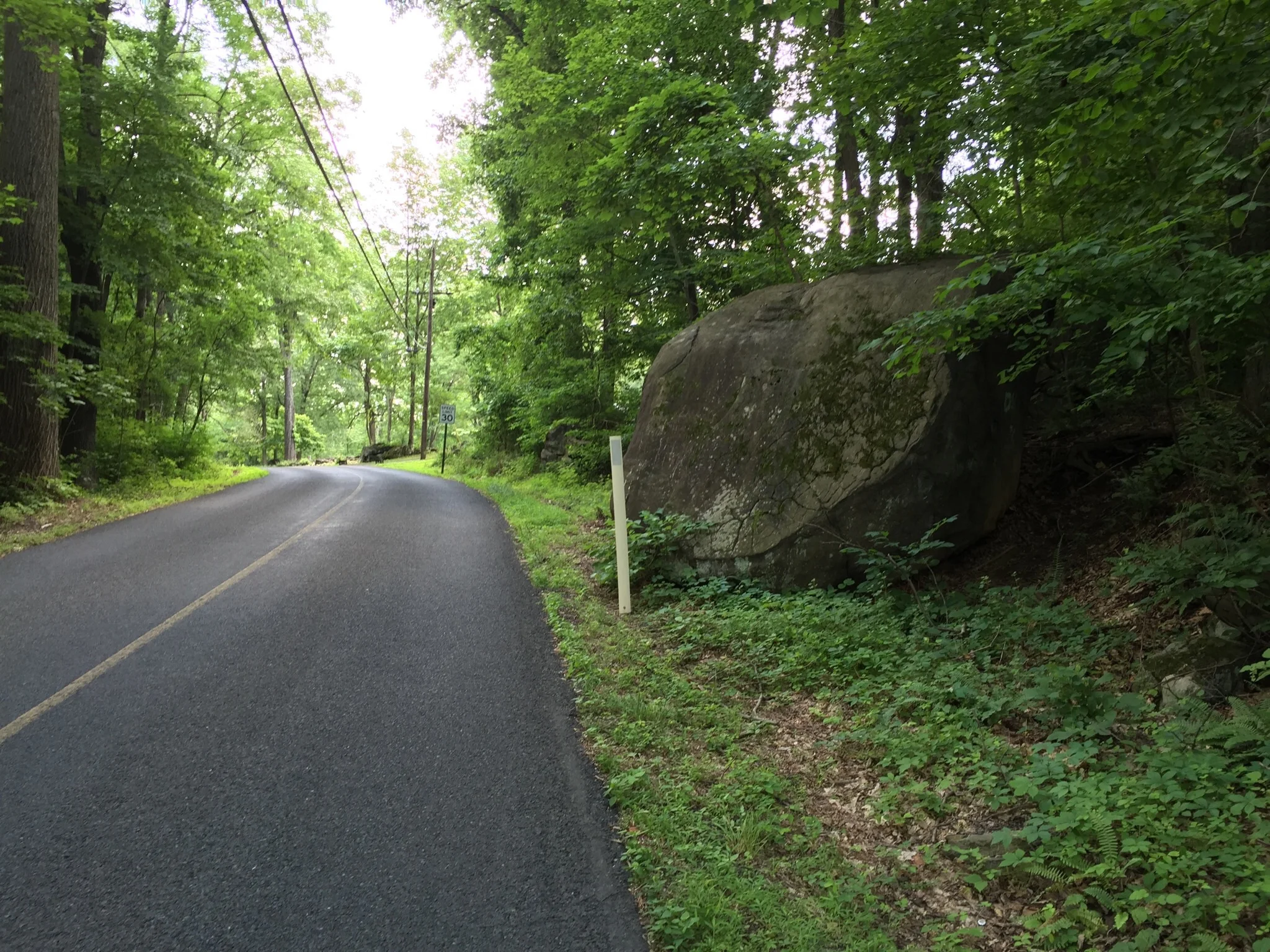 The aforementioned boulder on the side of Ringing Rocks Road to alert travelers to the vicinity of Ringing Rocks County Park.