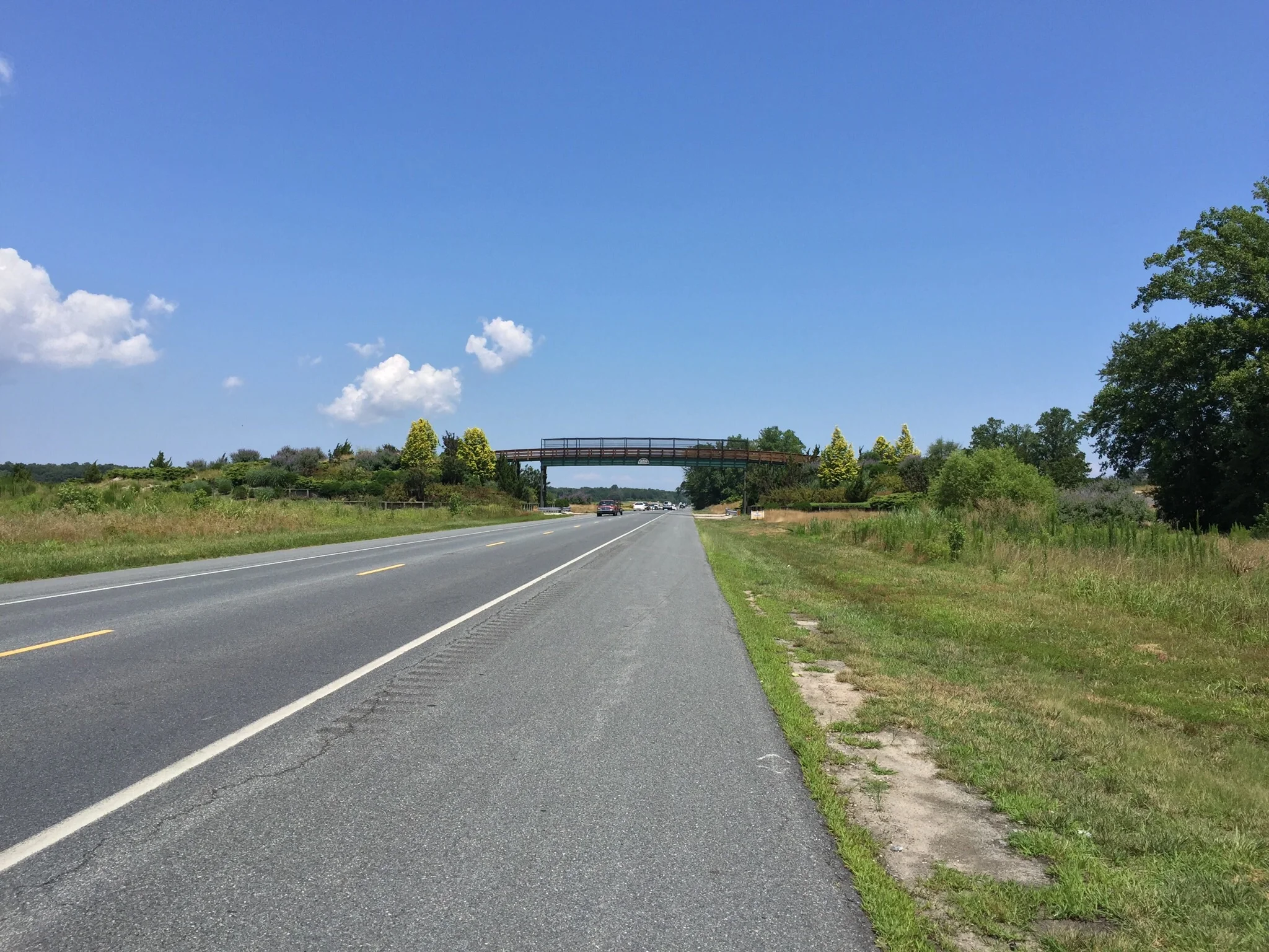 The golf cart bridge that crosses John J. Willams Highway. This also shows just how much space the bike lane grants.