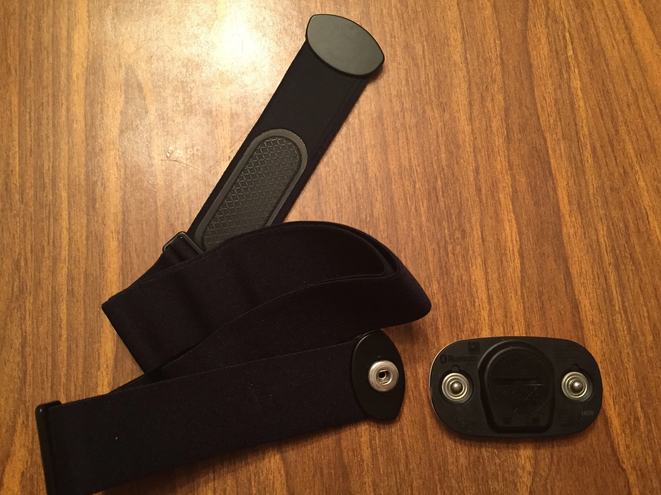 The soft strap has two gripper pads and snaps. The HRM snaps to the strap easily.
