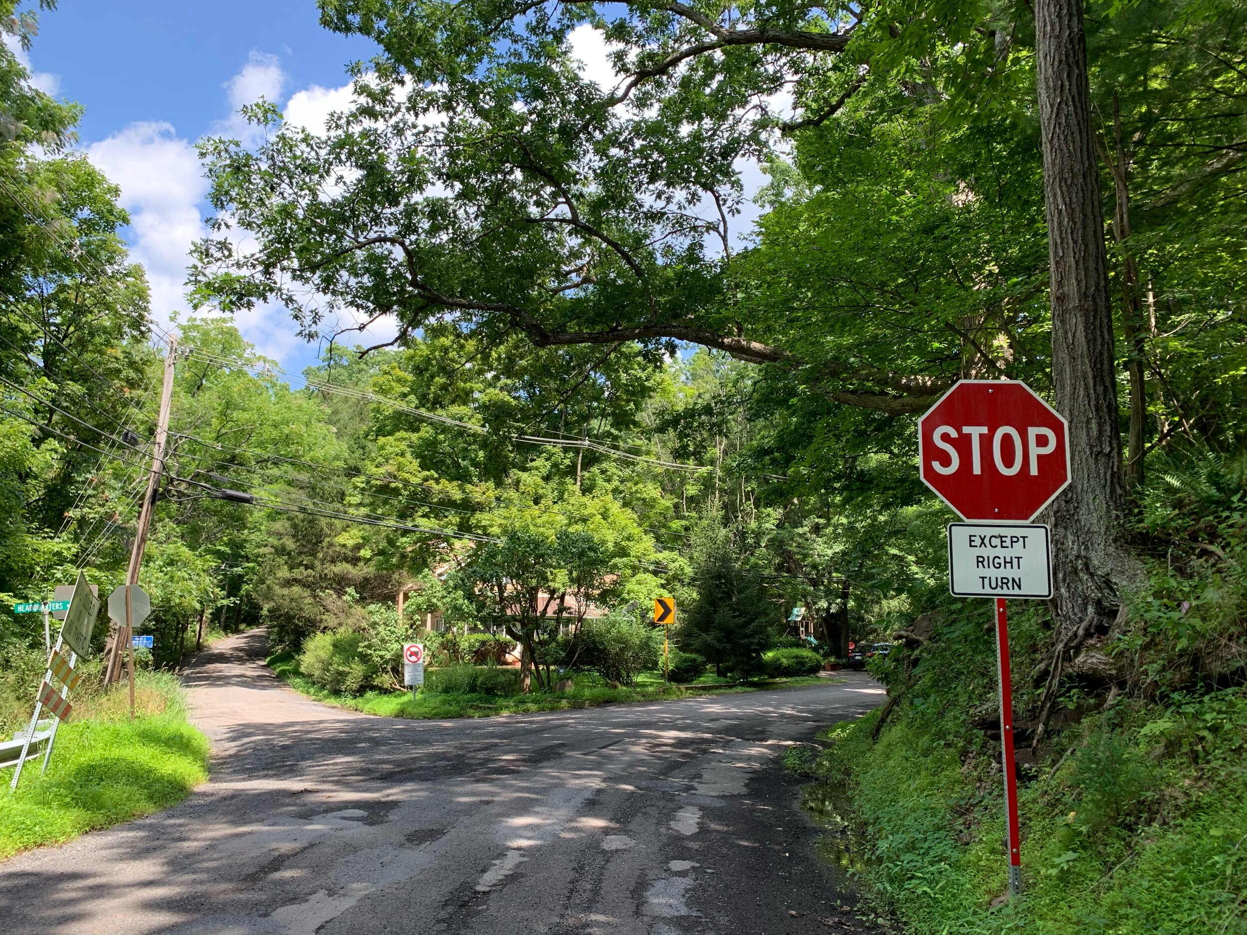 Headquarters Road has a less abrasive Except sign.