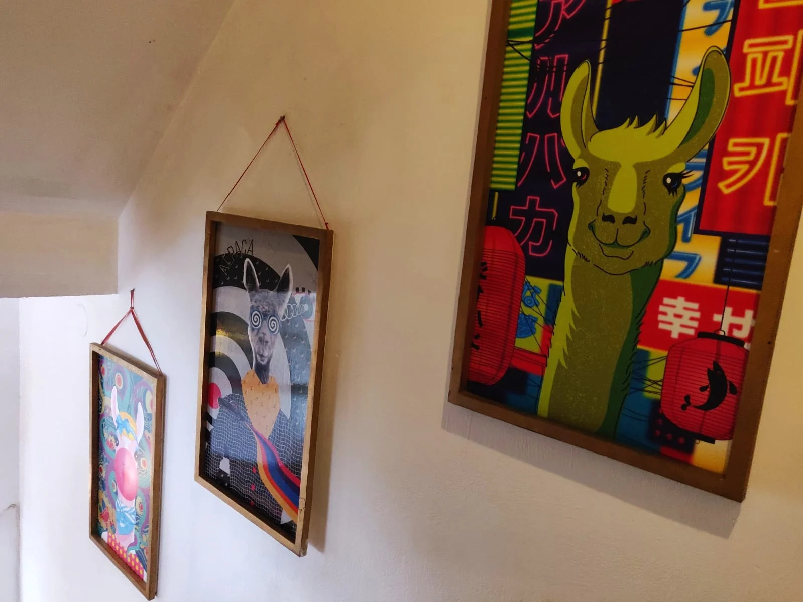 Quirky alpaca art adorns the walls of Alpaca Homestyle Cafe