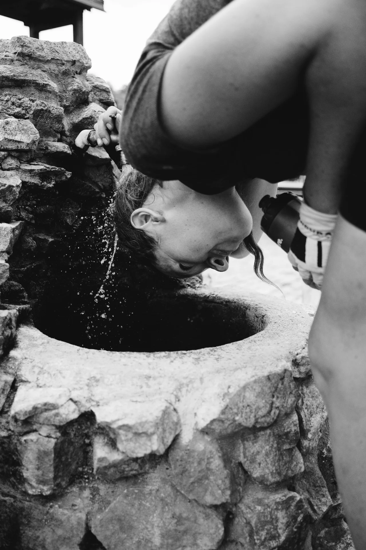 Jenny Tough cools off under a roadside fountain.