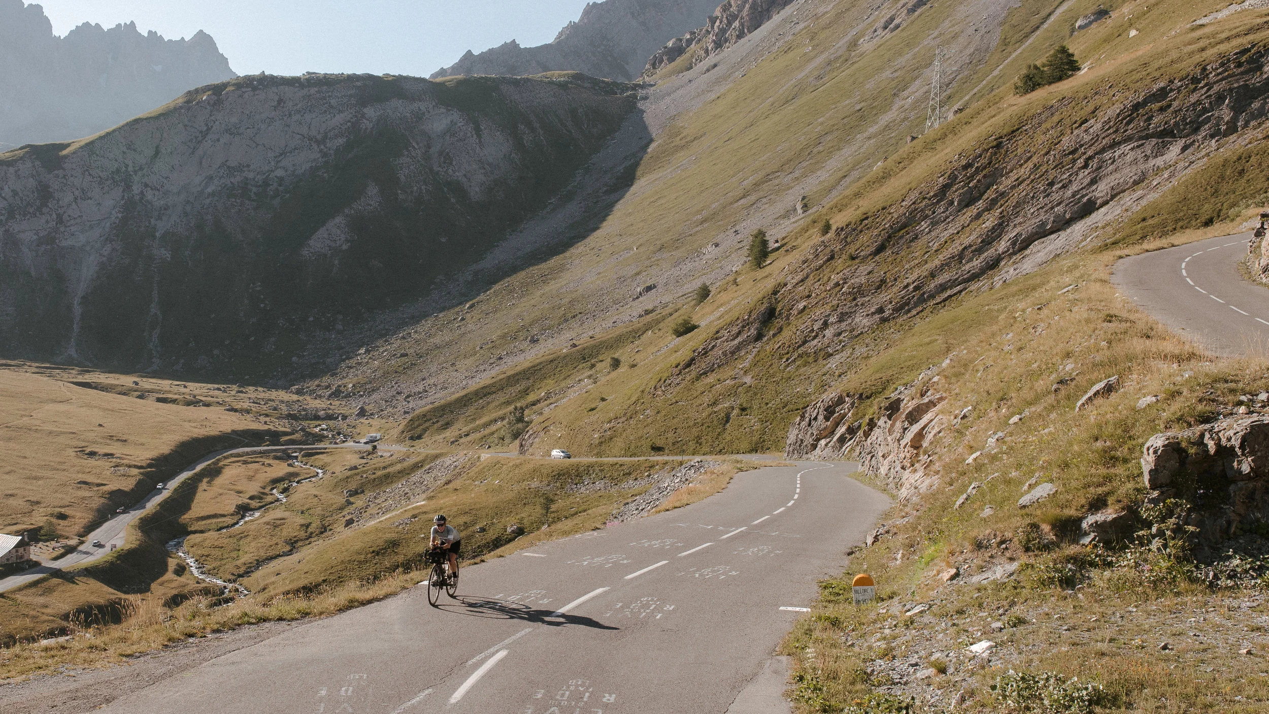 Fiona cruises along roads painted with names of Tour de France riders. Photo: Angus Sung©