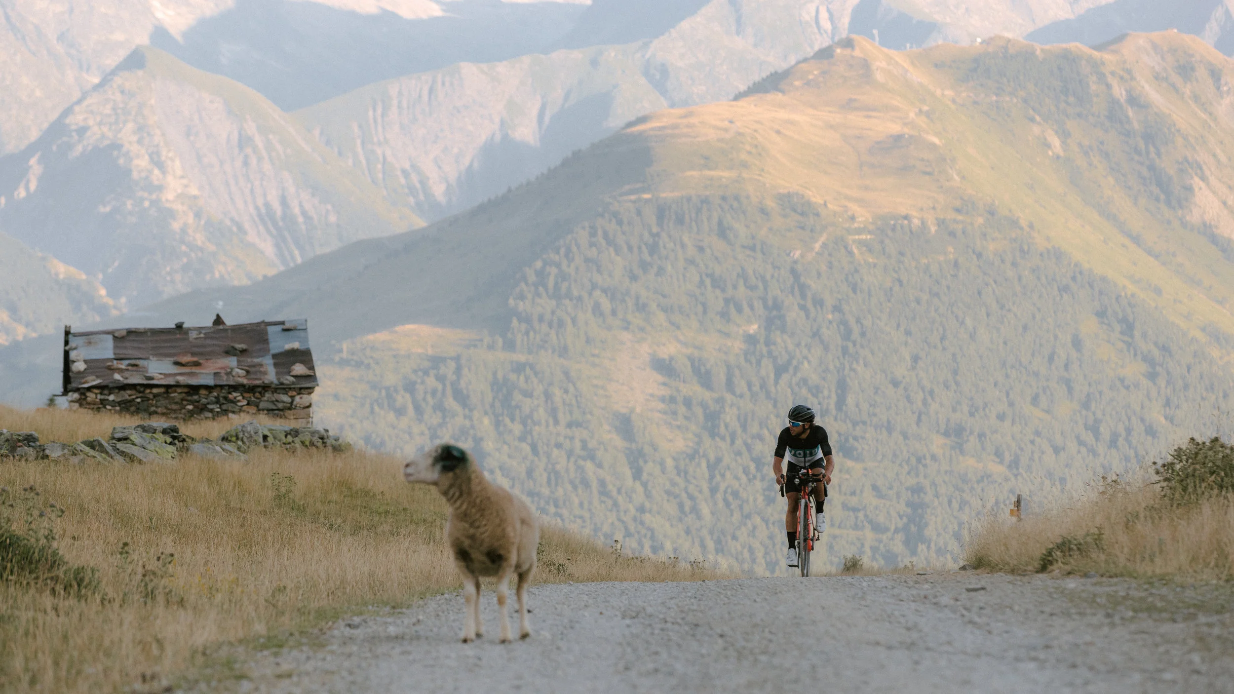 Ben Davies on the gravel roads of Route du Col de Sarenne towards Alpe d’Huez. Photo: Angus Sung©