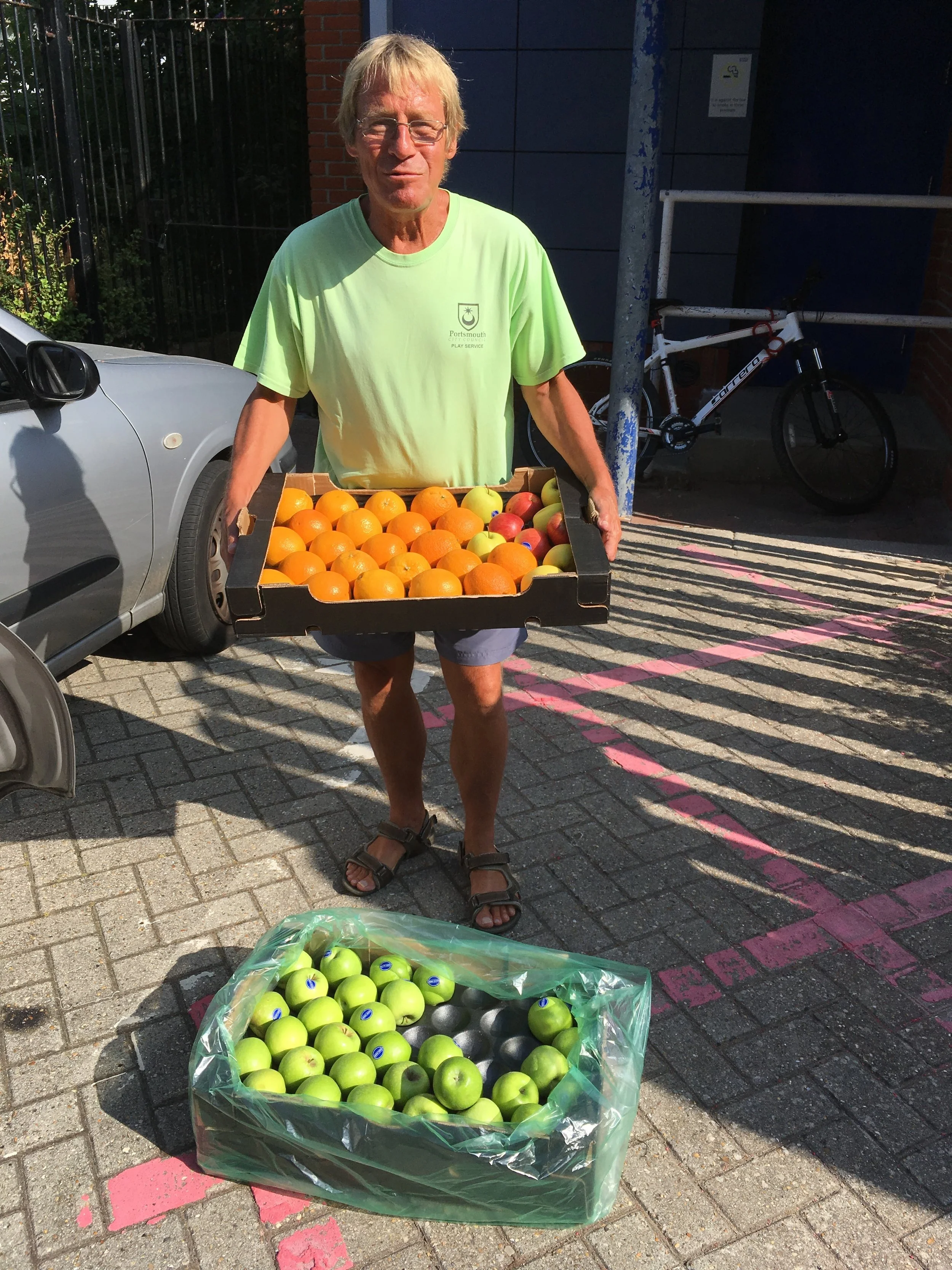 Play leader, Time Head from Stamshaw Adventure Playground collecting fresh fruit