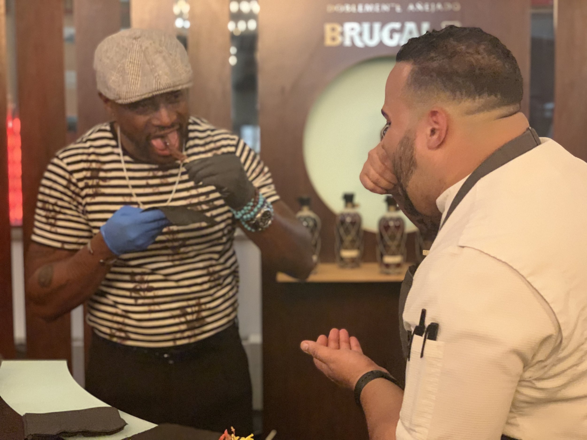Actor Taye Digg (left) and Chef Kelvin Tasting the Roasted Beef