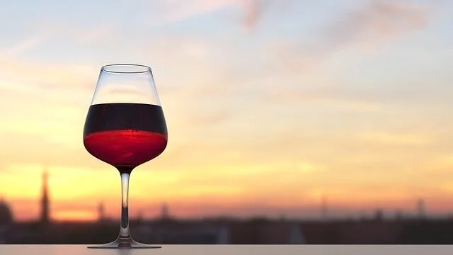 Glass-of-red-wine-on-an-outdoor-counter-at-sunset.jpg