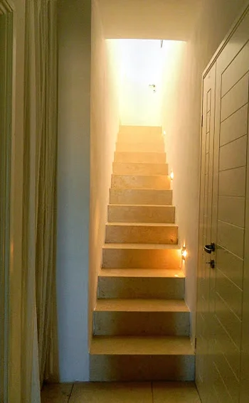 A staircase unites the upper with the ground level.jpg