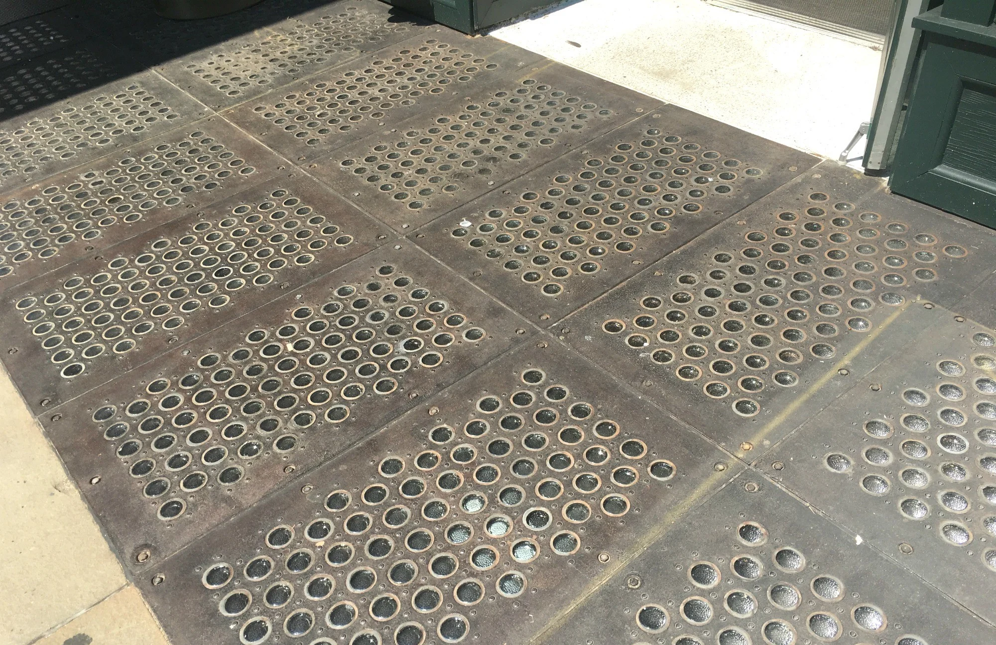Downtown Windowed Sidewalks Provided Light To Basement Factories Before Electricity