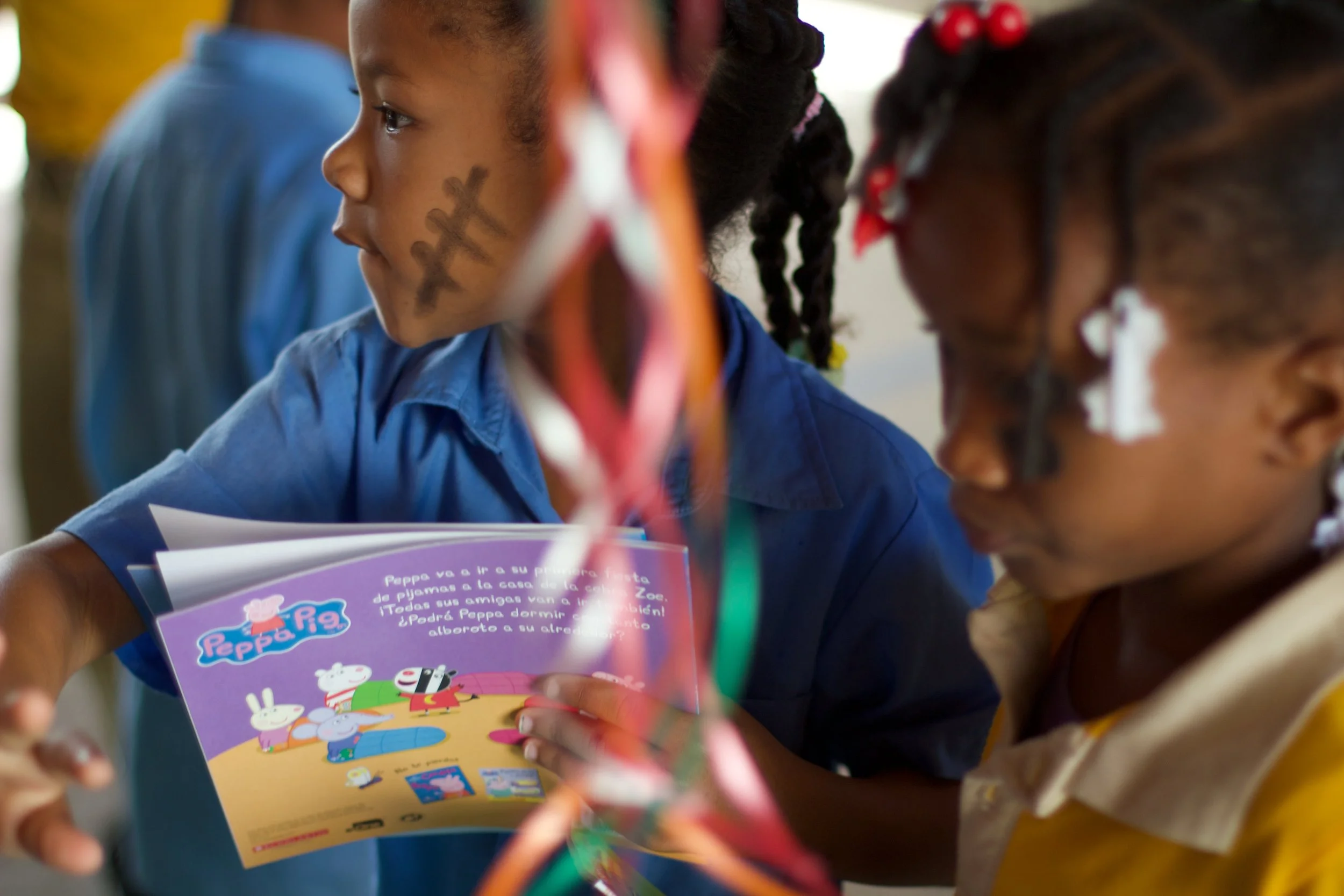 Students pick out three books to add to their personal library at home.