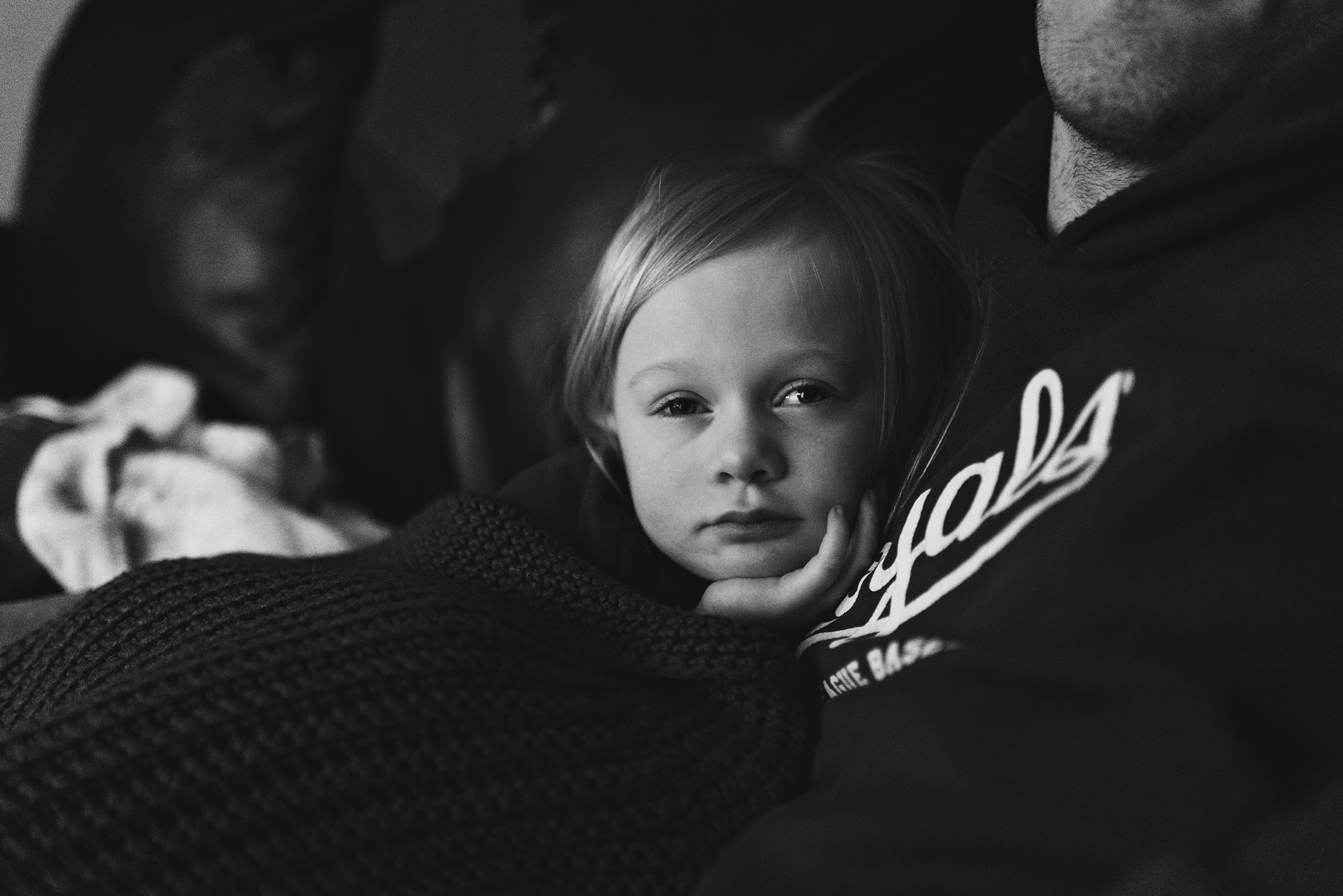 Little girl snuggling with dad
