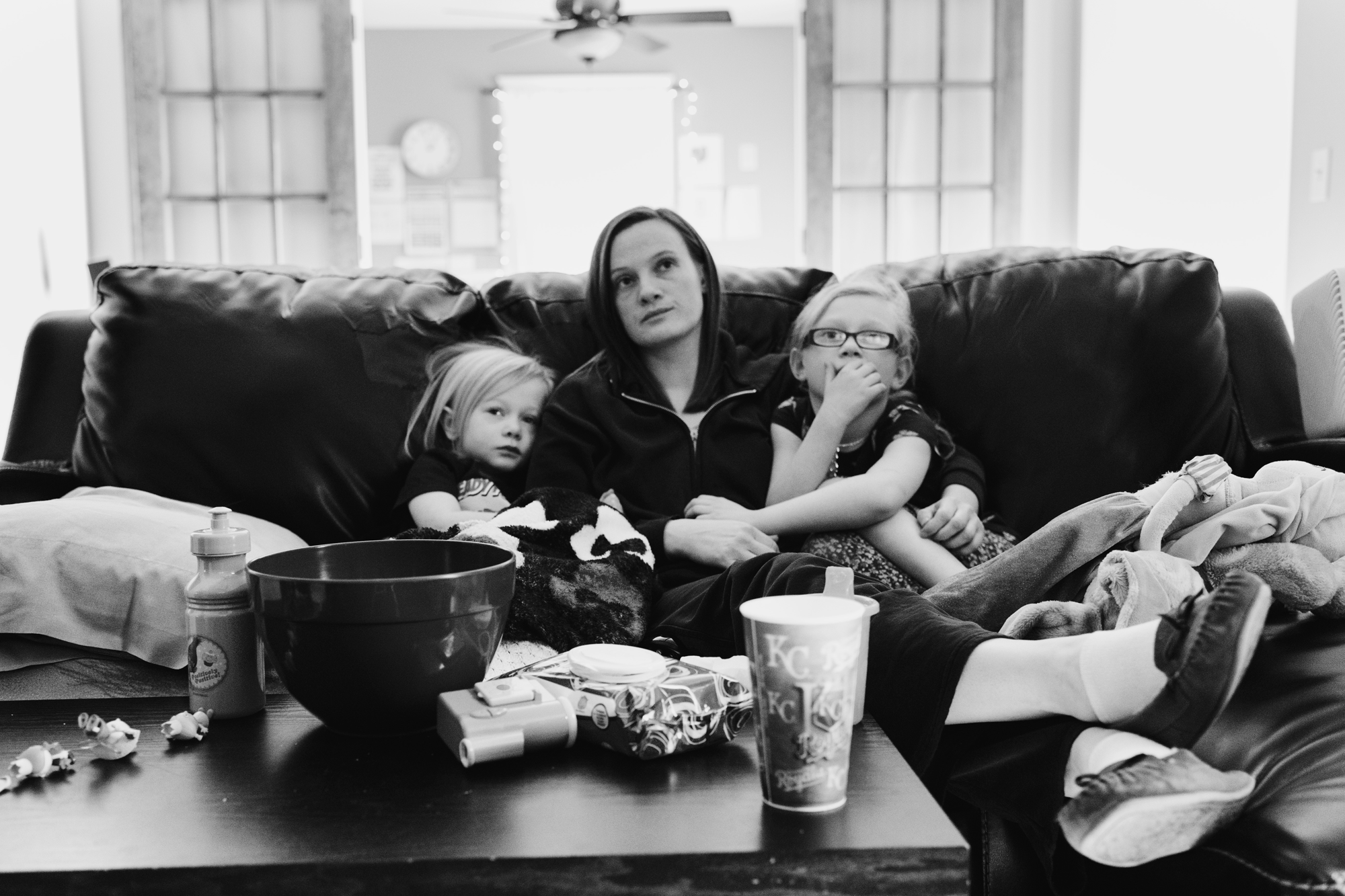 Mother sitting with two sick daughters