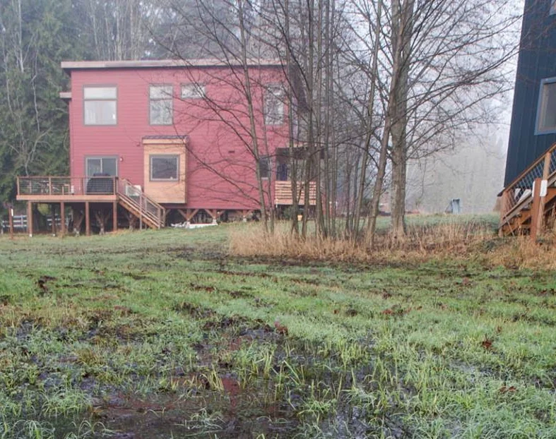 Houses in Clearwater Commons, showing pin foundations. Photo courtesy of Clearwater Commons Facebook page .