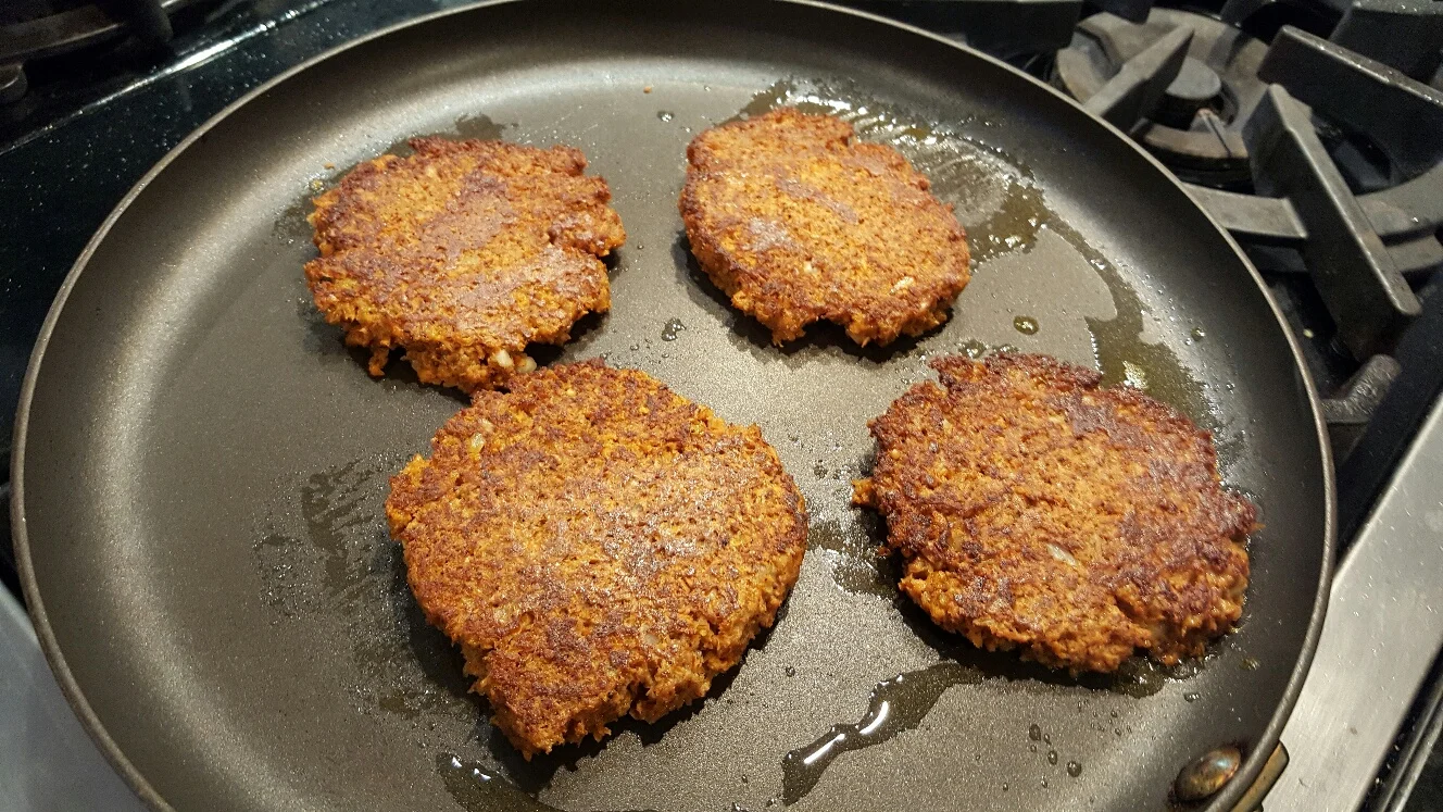 Cooking up the carrot patties.