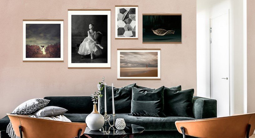 gallery posters on a pink wall