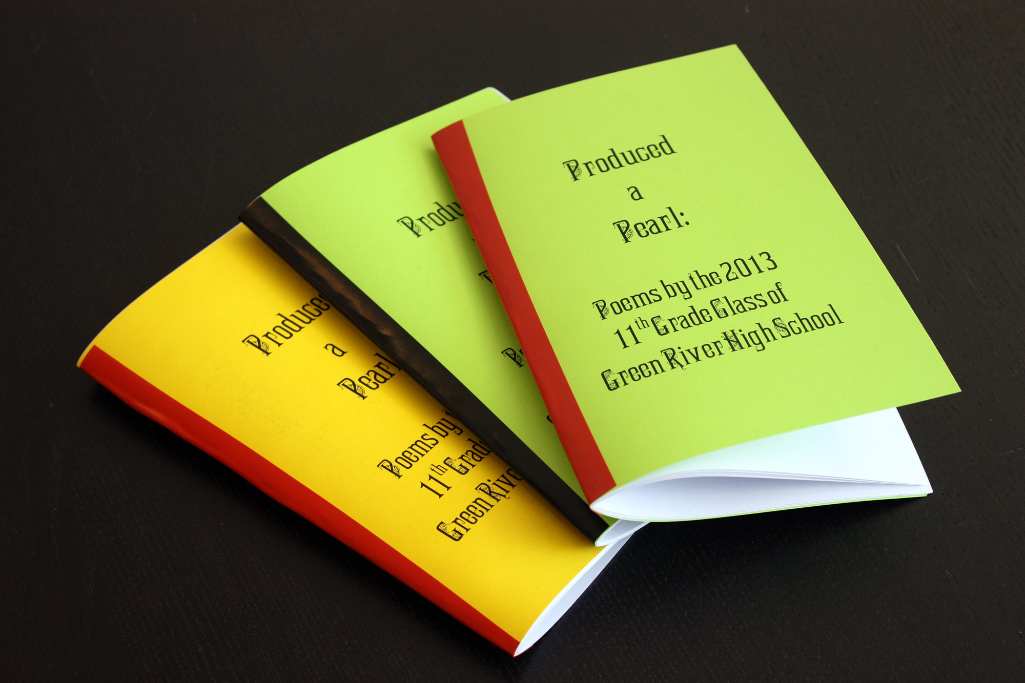 Copies of the “Produced A Pearl: Poems by the 2013 11th Grade Class of Green River High School” chapbook facilitated by Gina Abelkop