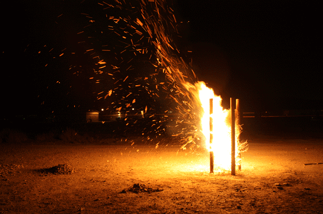 Pyre , 2012, wood, barbed wire, tumbleweeds, fire. Dimensions variable.