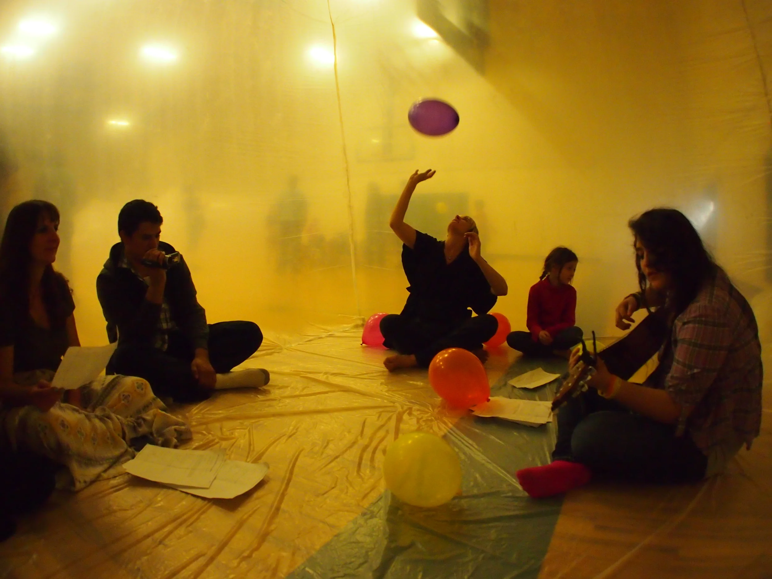 Judith Trejo performing inside of the cube inflatable.