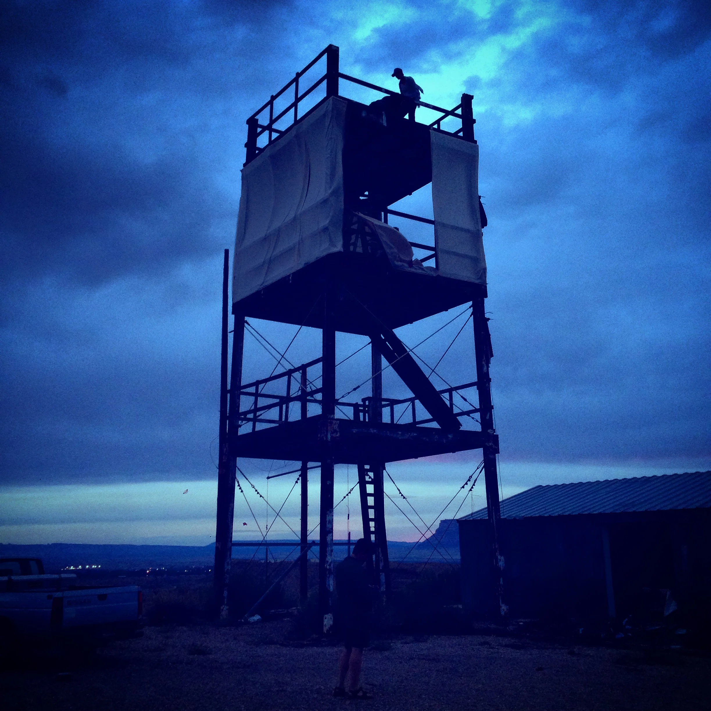 Launch Tower in progress, at twilight, and at night.