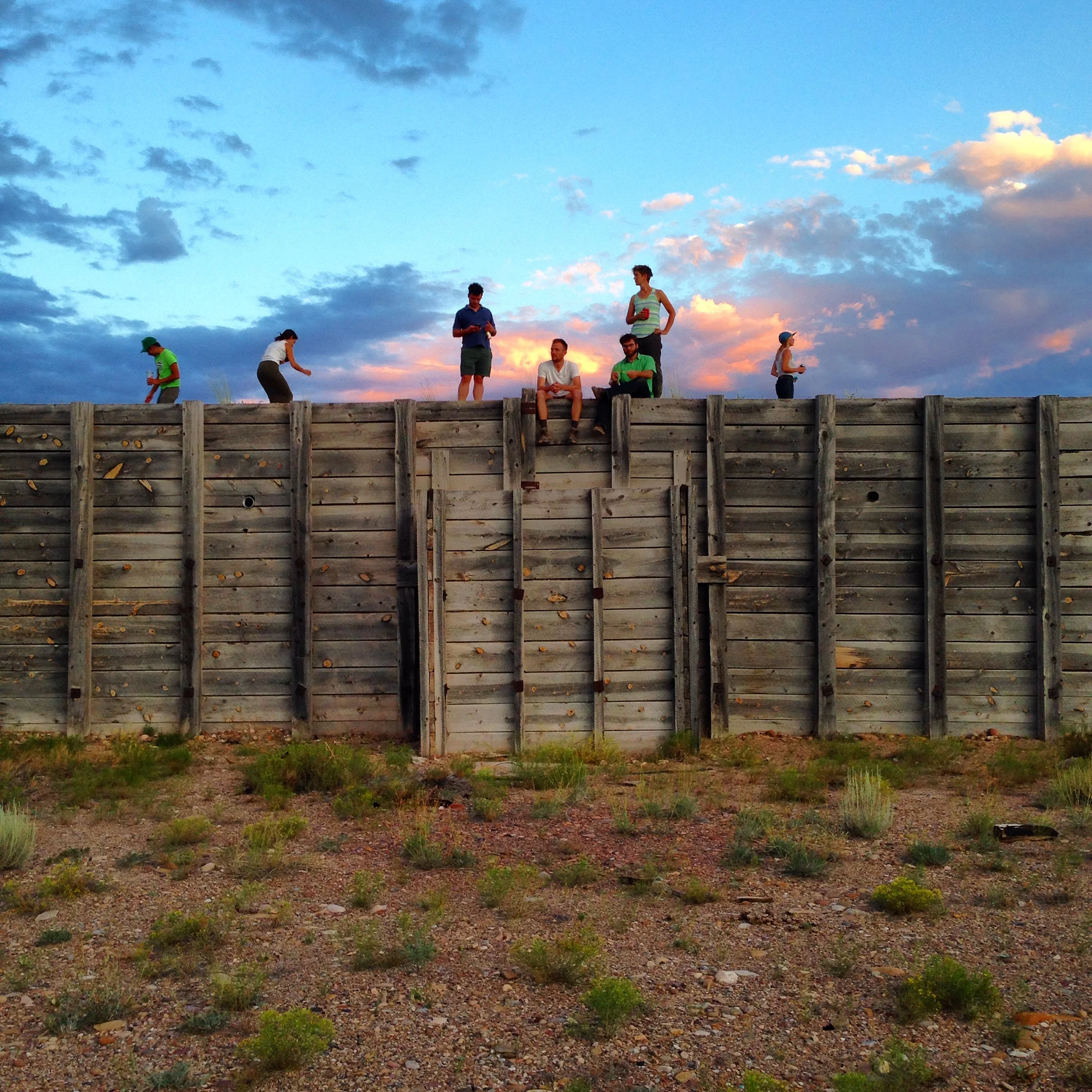 Epicenter staff, friends, and artist Lisa Ward enjoying the sunset from the top of The Bunker.