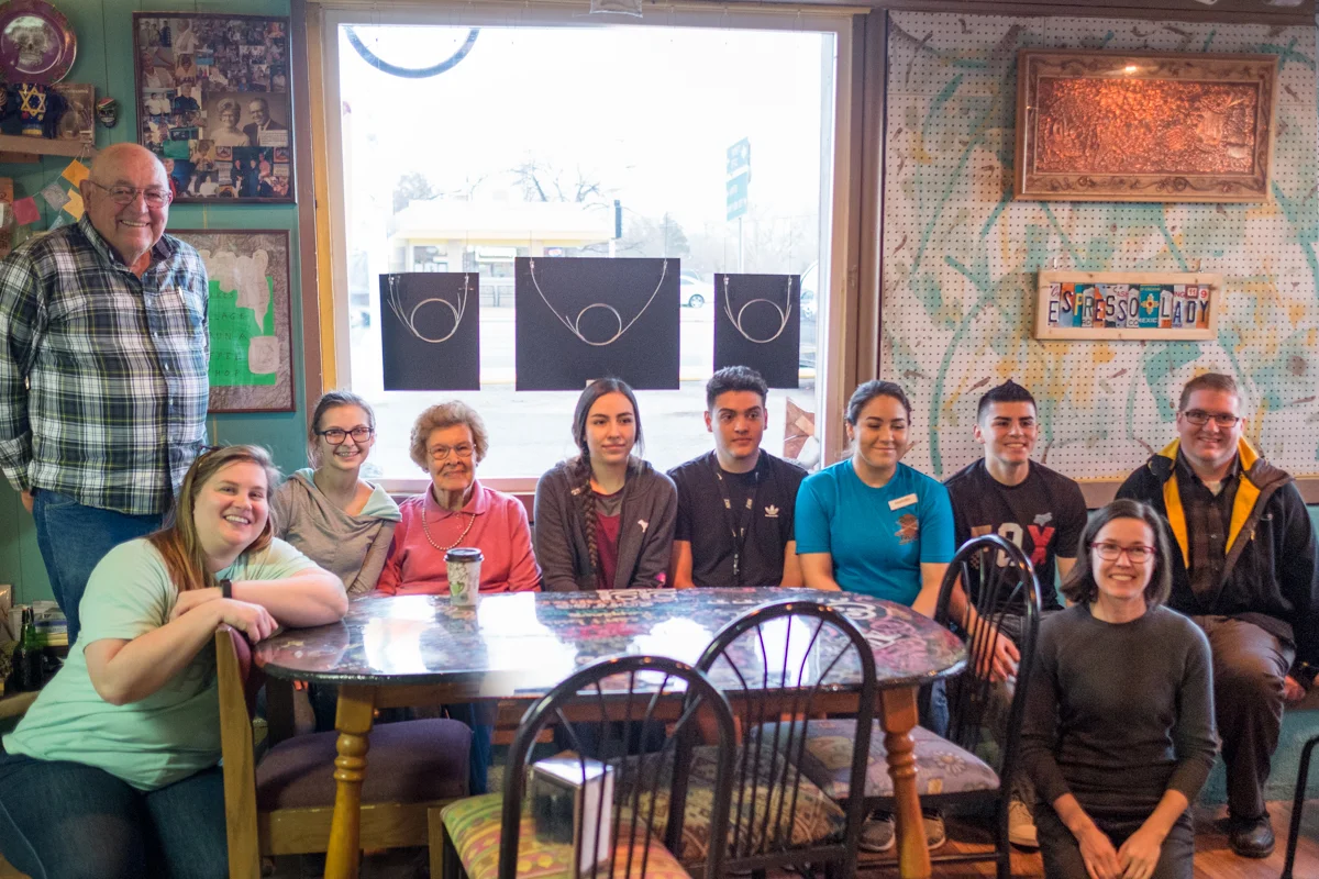 Some of the participants in Senior Spotlight, back row, from left: Coombs Hall, Lindsey McFarlane, Gladys May, Daniela Mendez, Roman Medina, Maribel Escalante, Freddy Escalante, and teacher Craig Gowans. Front: Maria Sykes (Epicenter Director) and Jamie Horter (Frontier Fellow). Not pictured: student Marcela Soto and interviewed seniors Dean and Hilda King, Ardon and Carolyn Sherril, and Catherine Kane.