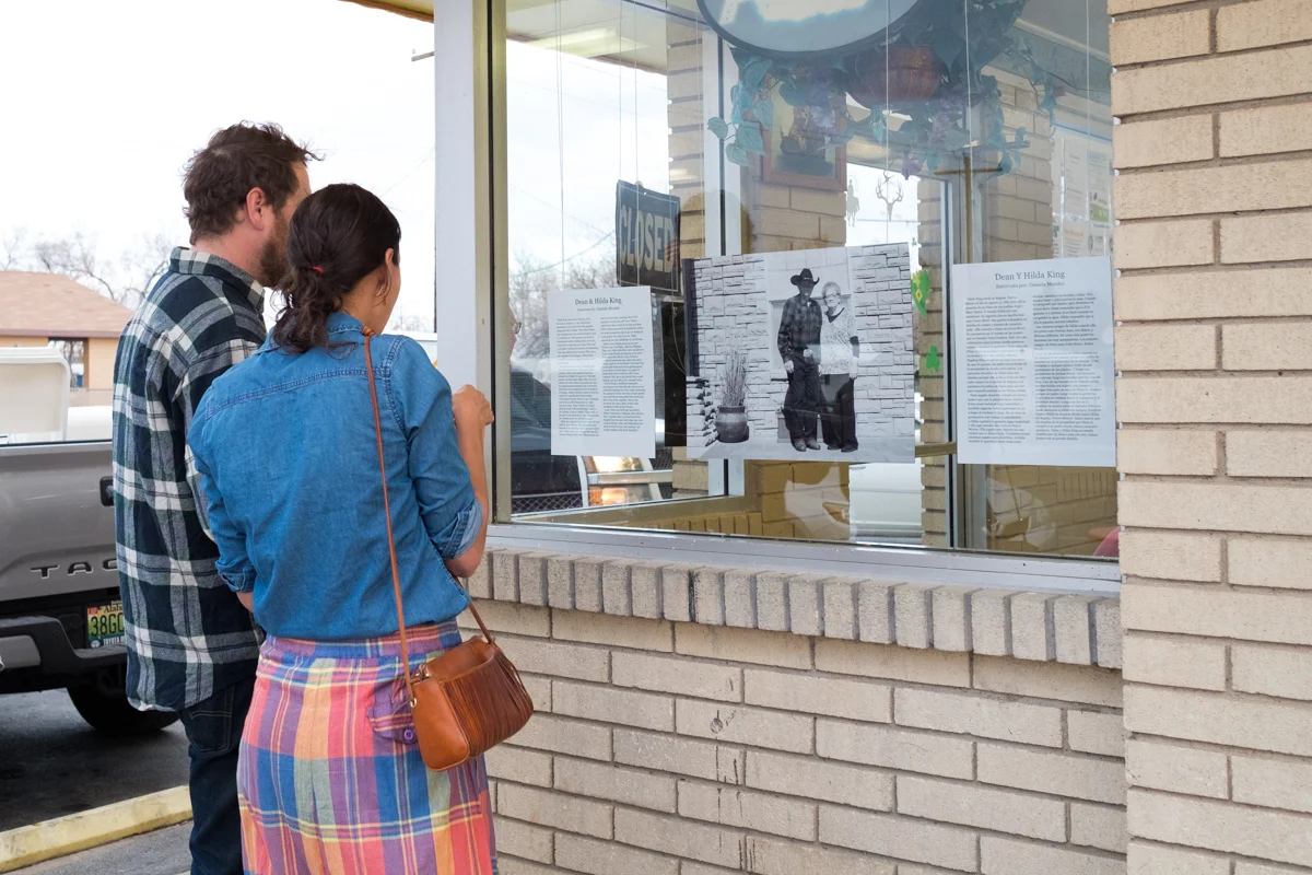 Green River locals stop to read stories about the senior citizens in their community.
